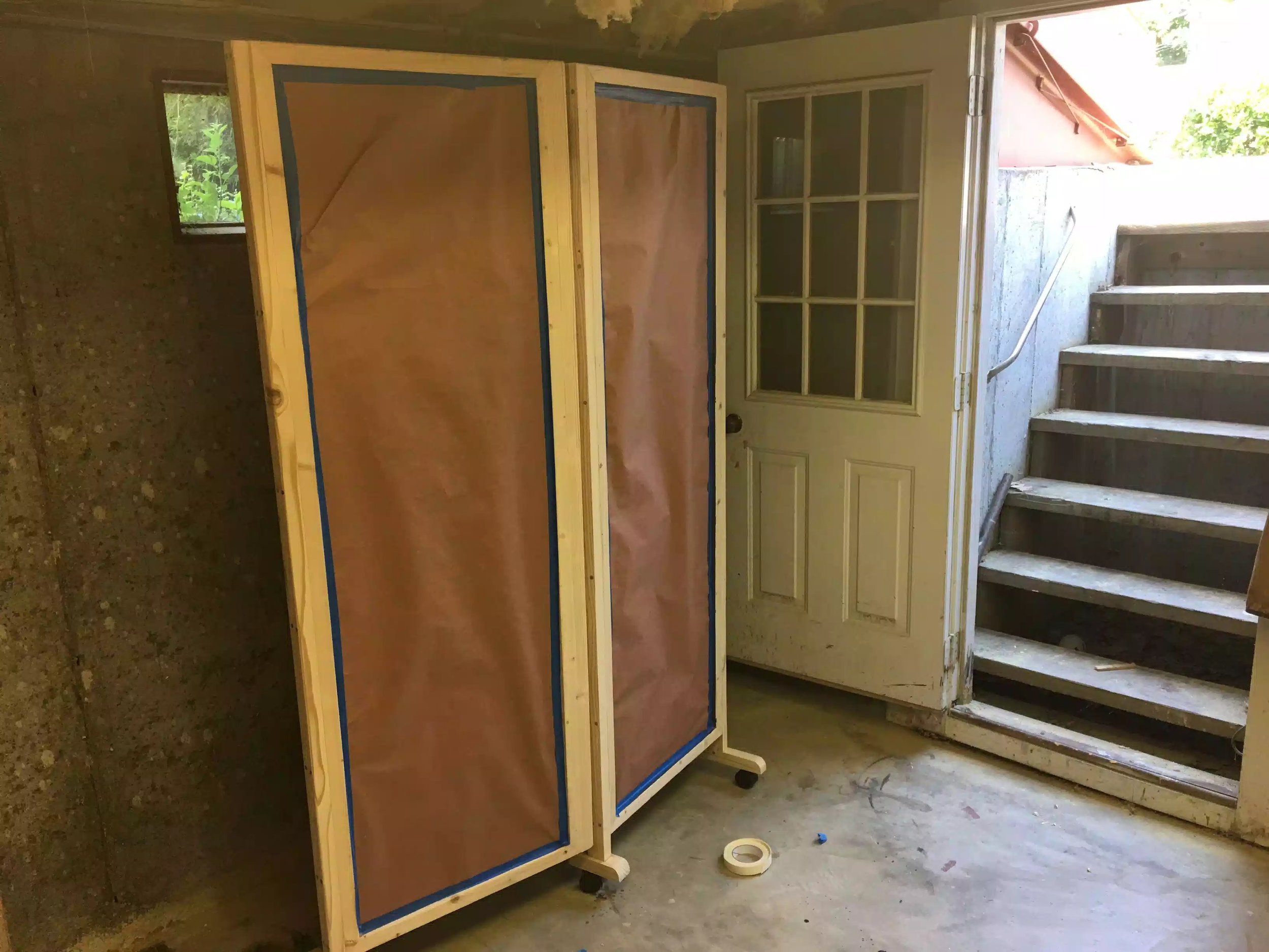 Here is the rosin paper covering the back side of the divider, covering the cork-board and chalk-board so as to avoid getting polyurethane on them.