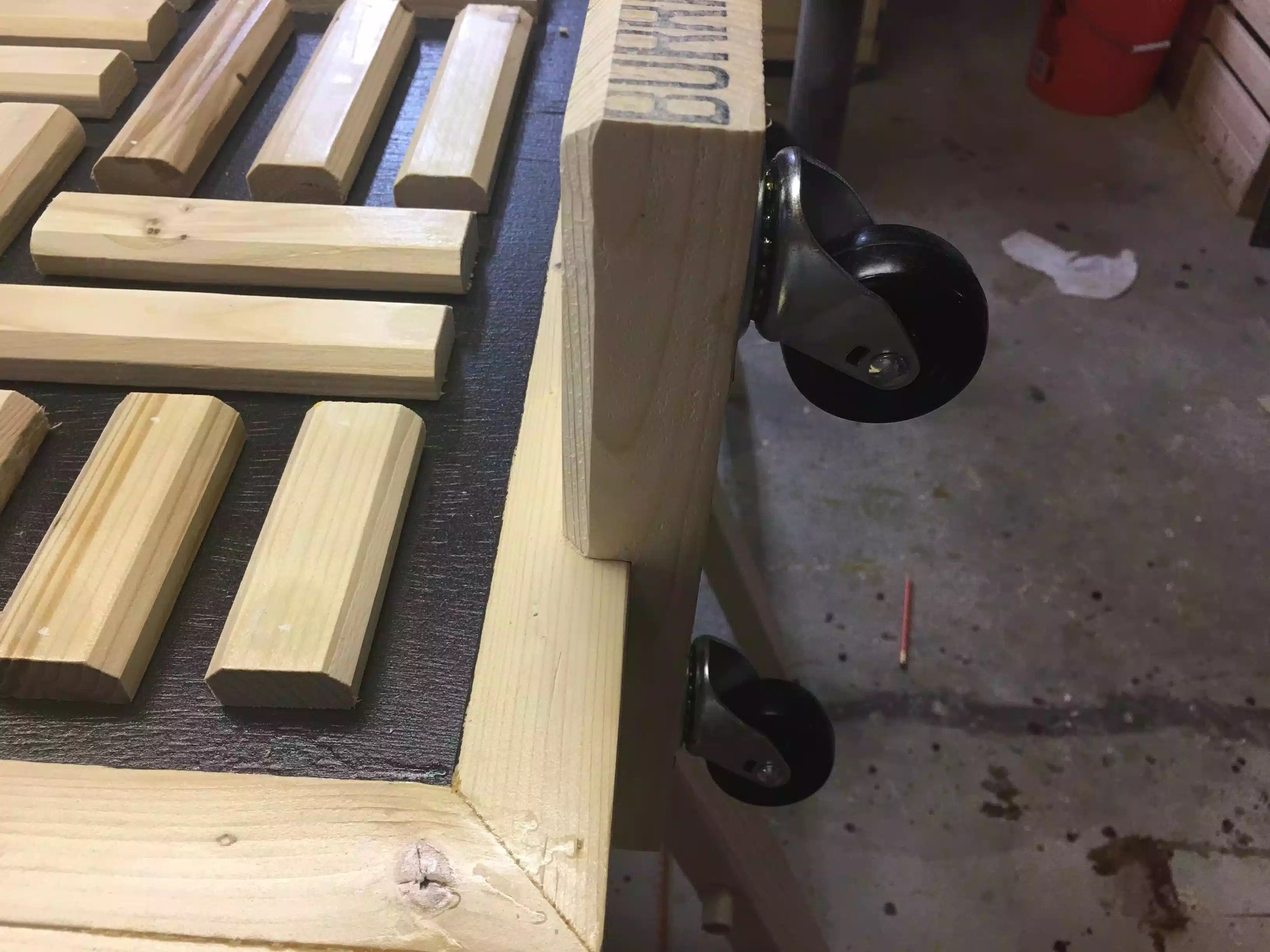 Here you can see the new leg assembly, you can see the notch that I cut into the 2x4, I also chamfered the 2x4 to match the herringbone pattern.