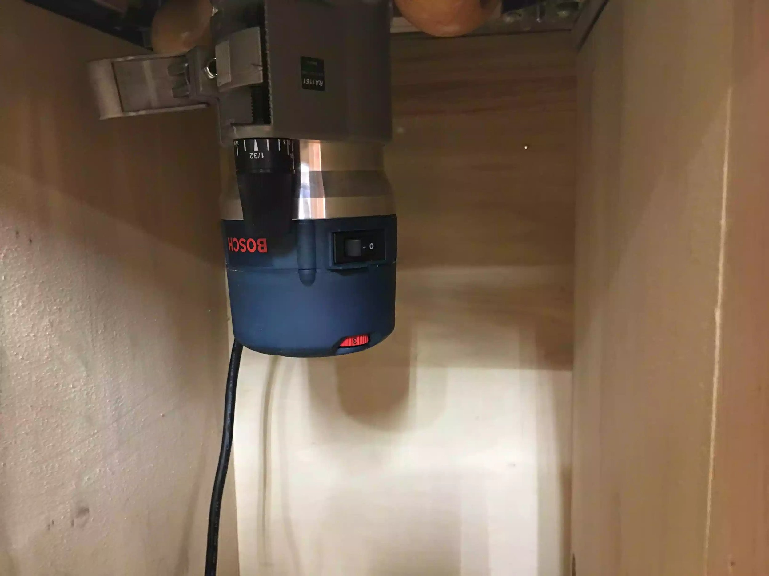 Here is the router under the table, its really powerful and has an awesome feature that let's me adjustments in bit height from the top of the table