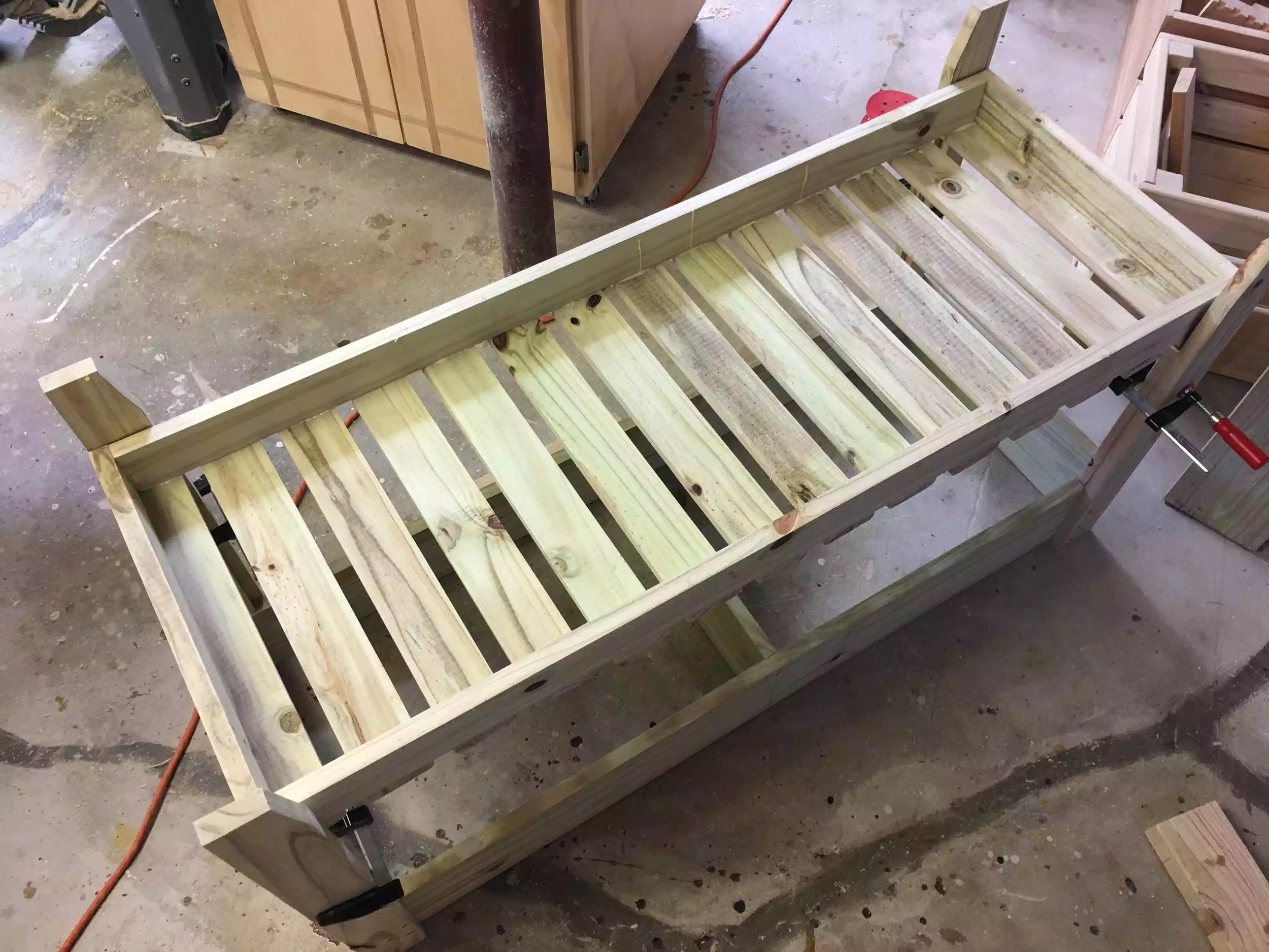 Finally here is the bottom shelf assembly turned upside down and resting on the spacers , all that was left was to screw them home