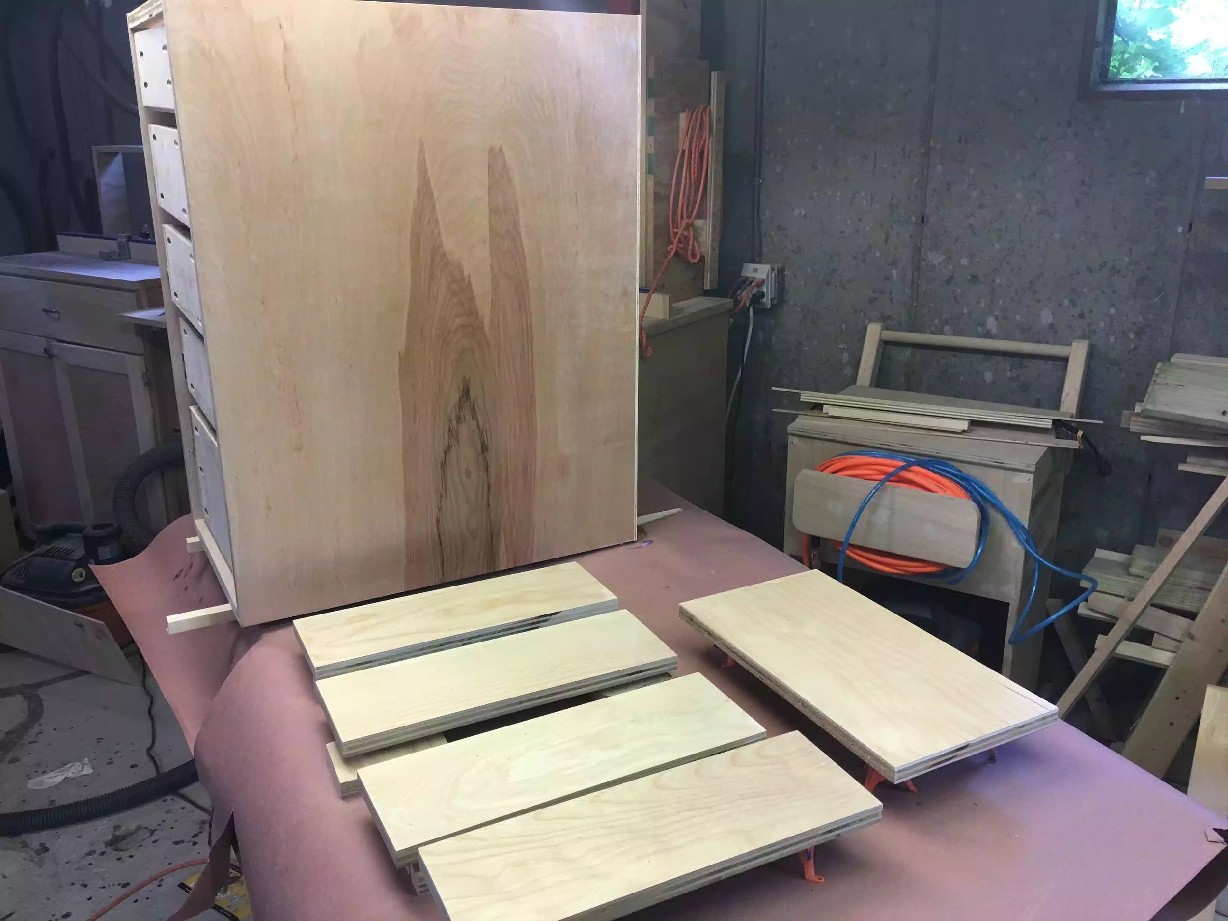 I moved everything to a smaller bench and applied the 3rd coat, I love how the grain popped on the cabinet side.