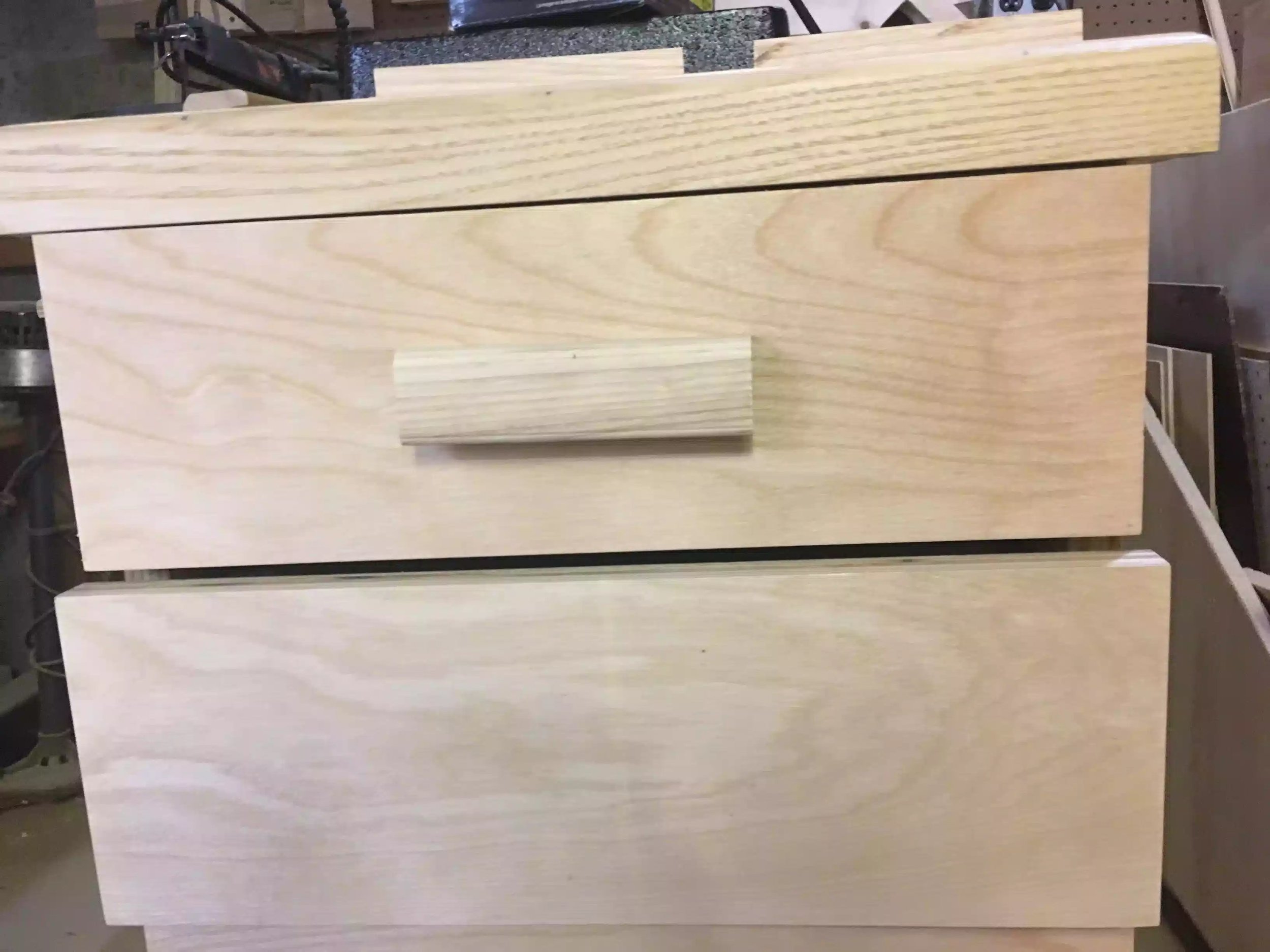 Here is the first drawer pull installed and I have to say that the pulls look awesome and match the solid edge banding on the cabinet top.