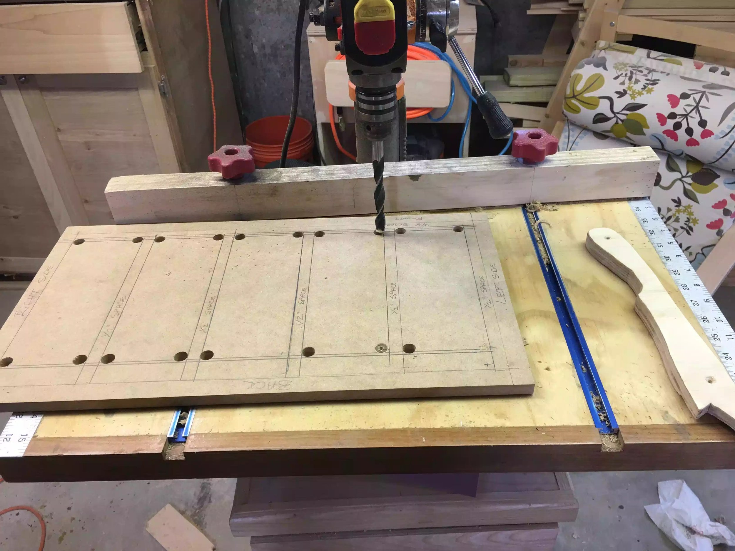 Here is the drill press in action drilling out the 1/2” holes, this diameter bit has just enough room for me to fit my jigsaw blade through.