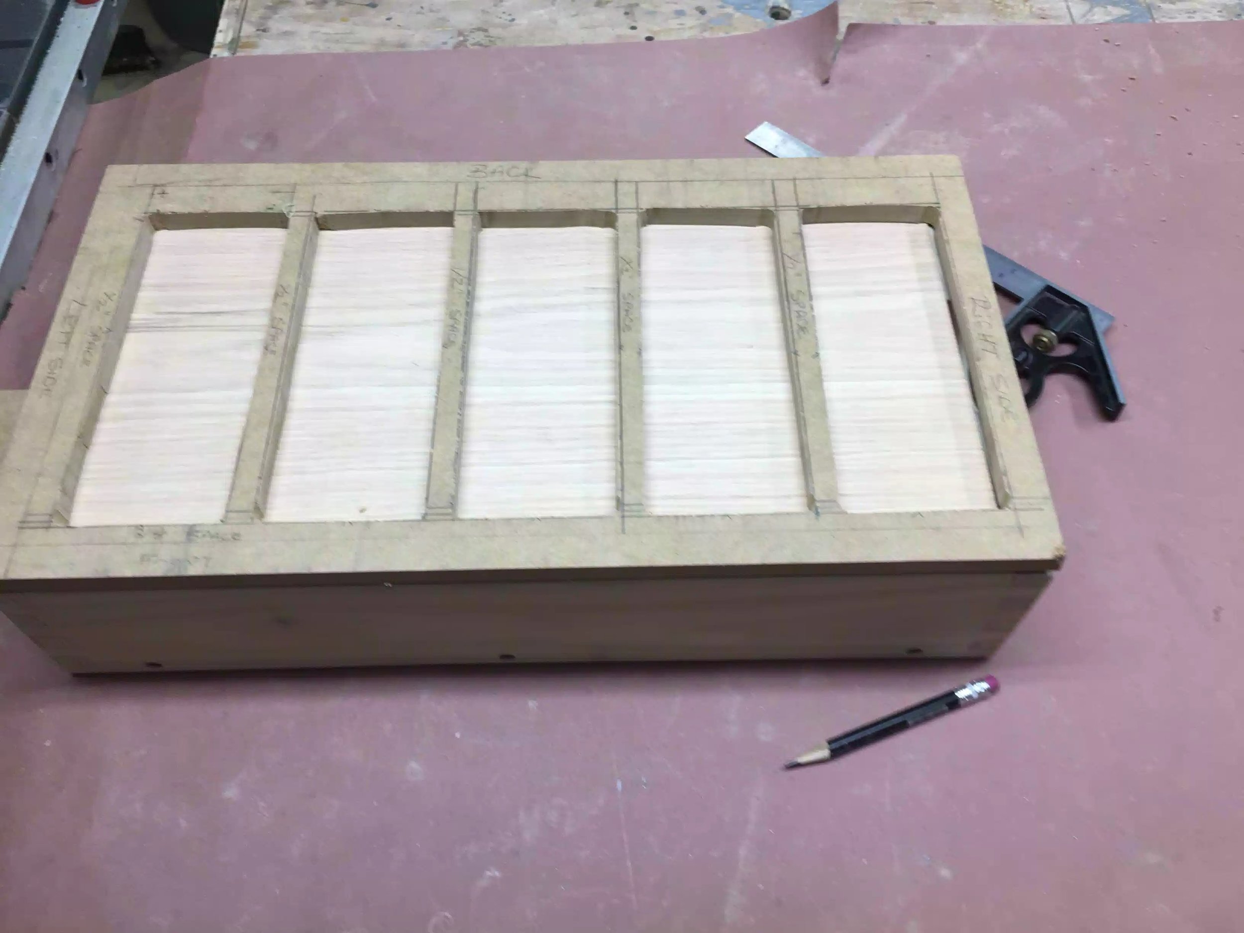 Here is a picture of the template on the oak work-piece, I used double-side tape to secure the template to the oak top.