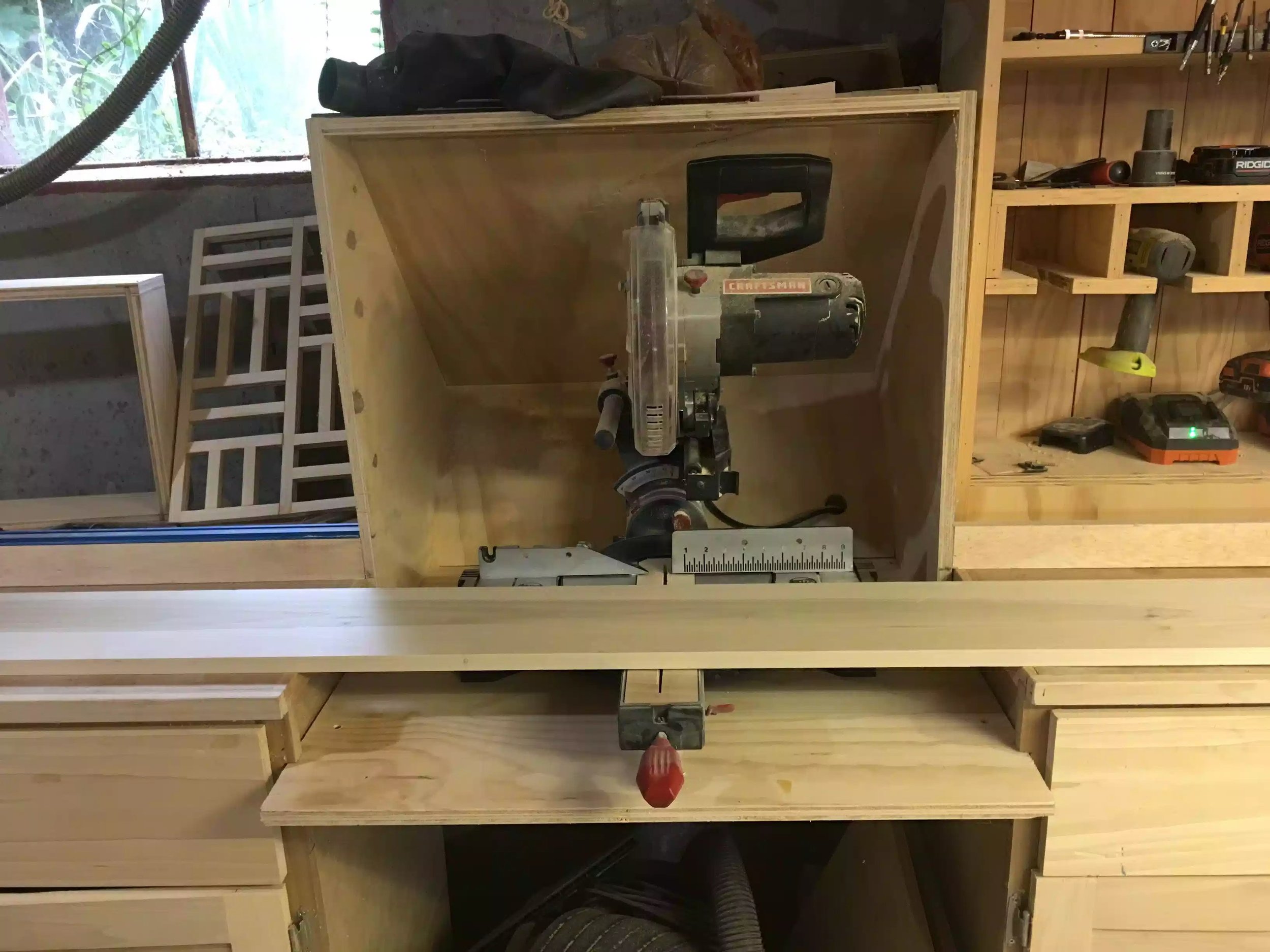 Crosscutting the board at my miter saw station.