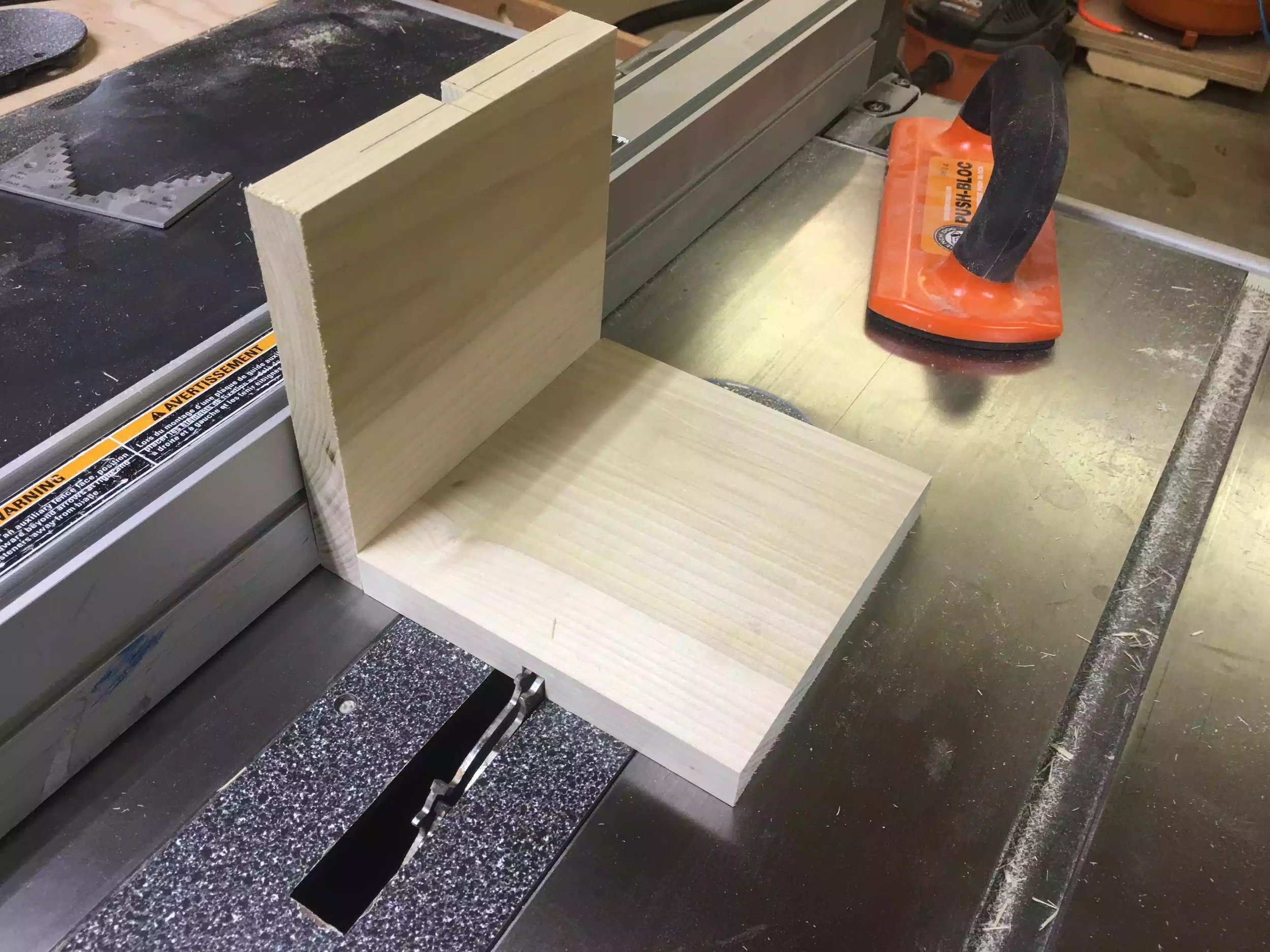 Here is the spacer block against the fence, when I remove the spacer block and move the work-piece against the fence it will center the next 2 grooves.