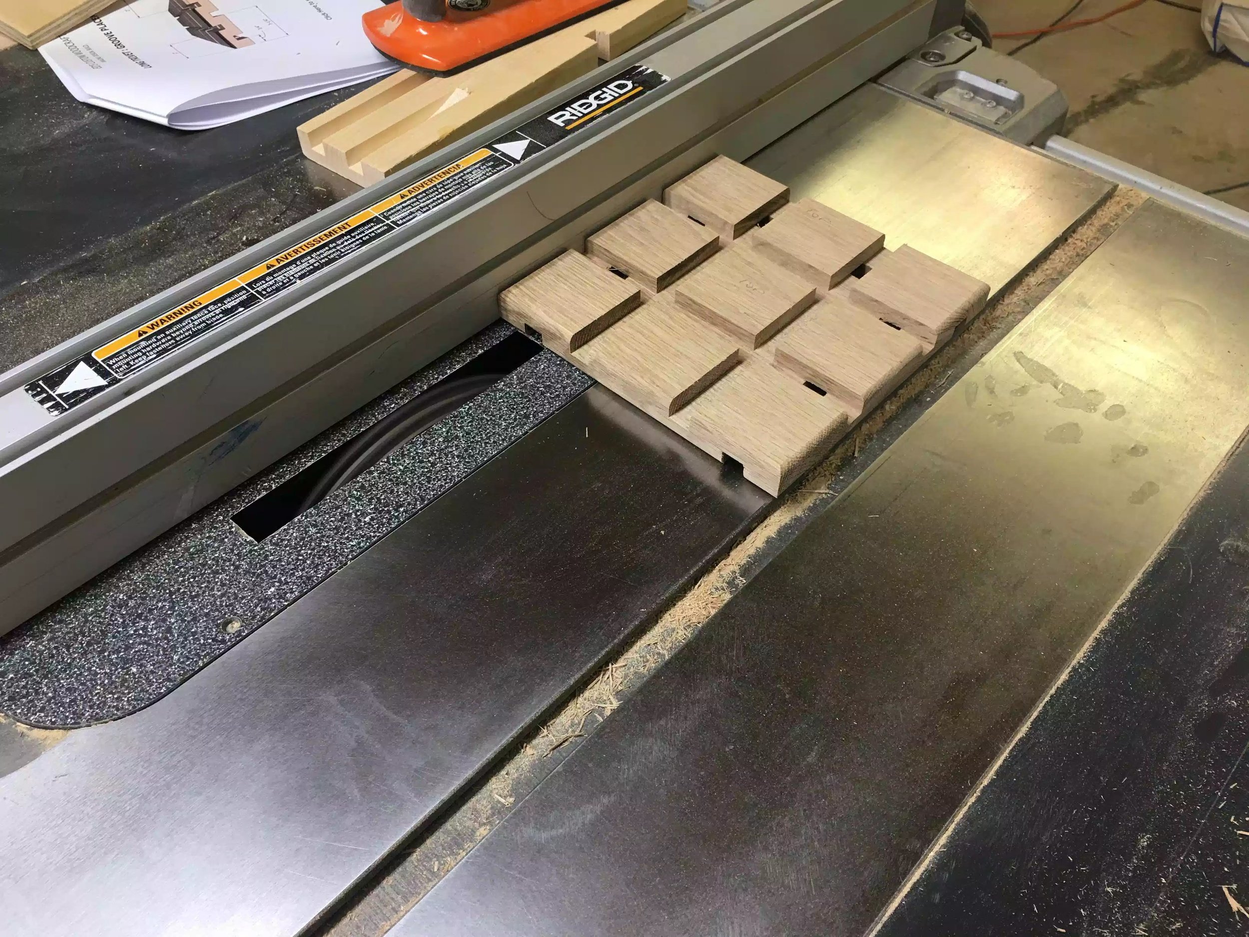 Here is the orientation of the trivet being run through the blade, the groove will be 3/4” from either edge and what this does is places a groove directly under the 2” x 2” squares on the top