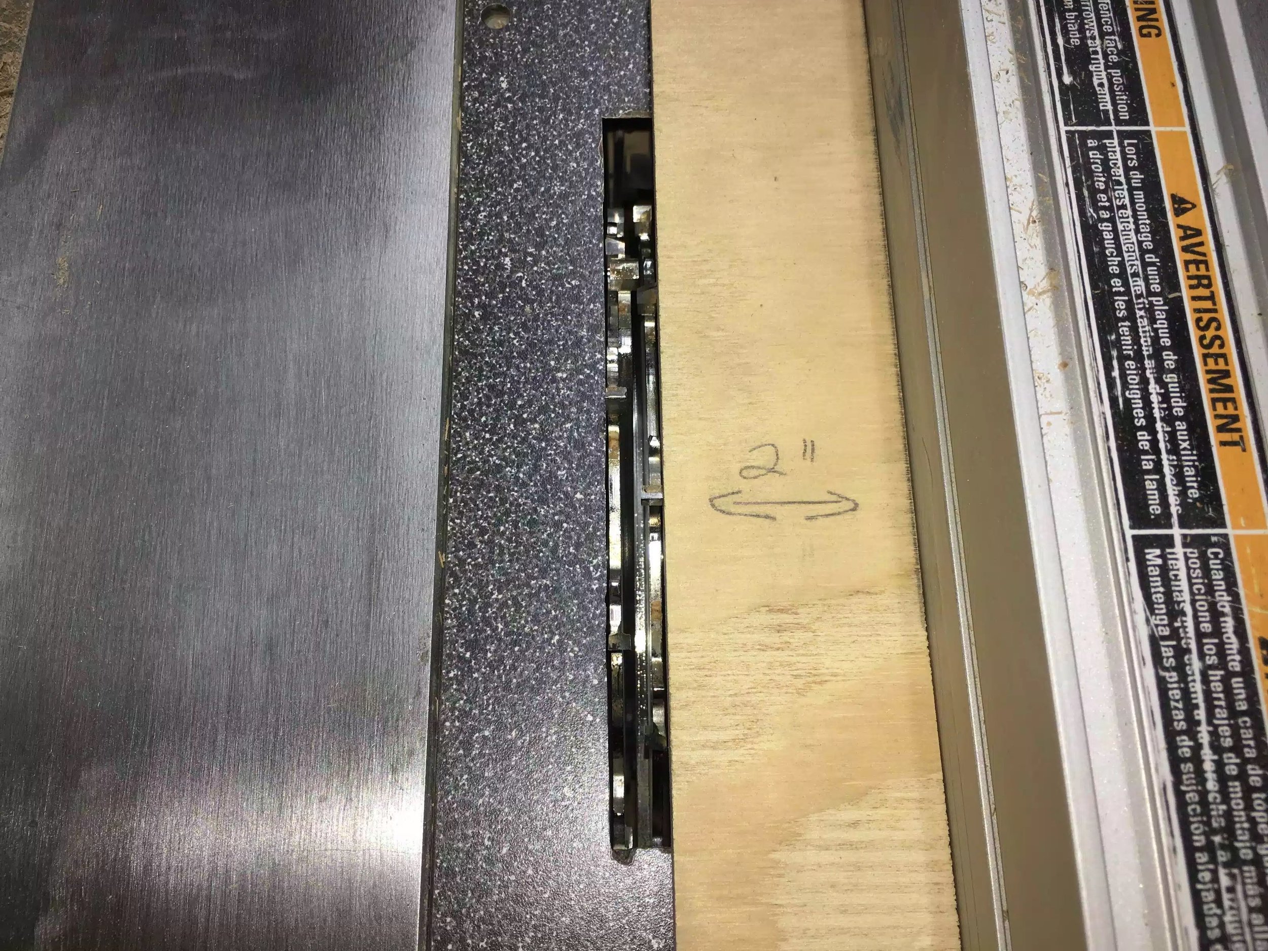 Here is a picture of the 2’ wide spacer to determine the distance from the blade to the rip fence, after the rip fence is clamped I remove the spacer block and run the board through.
