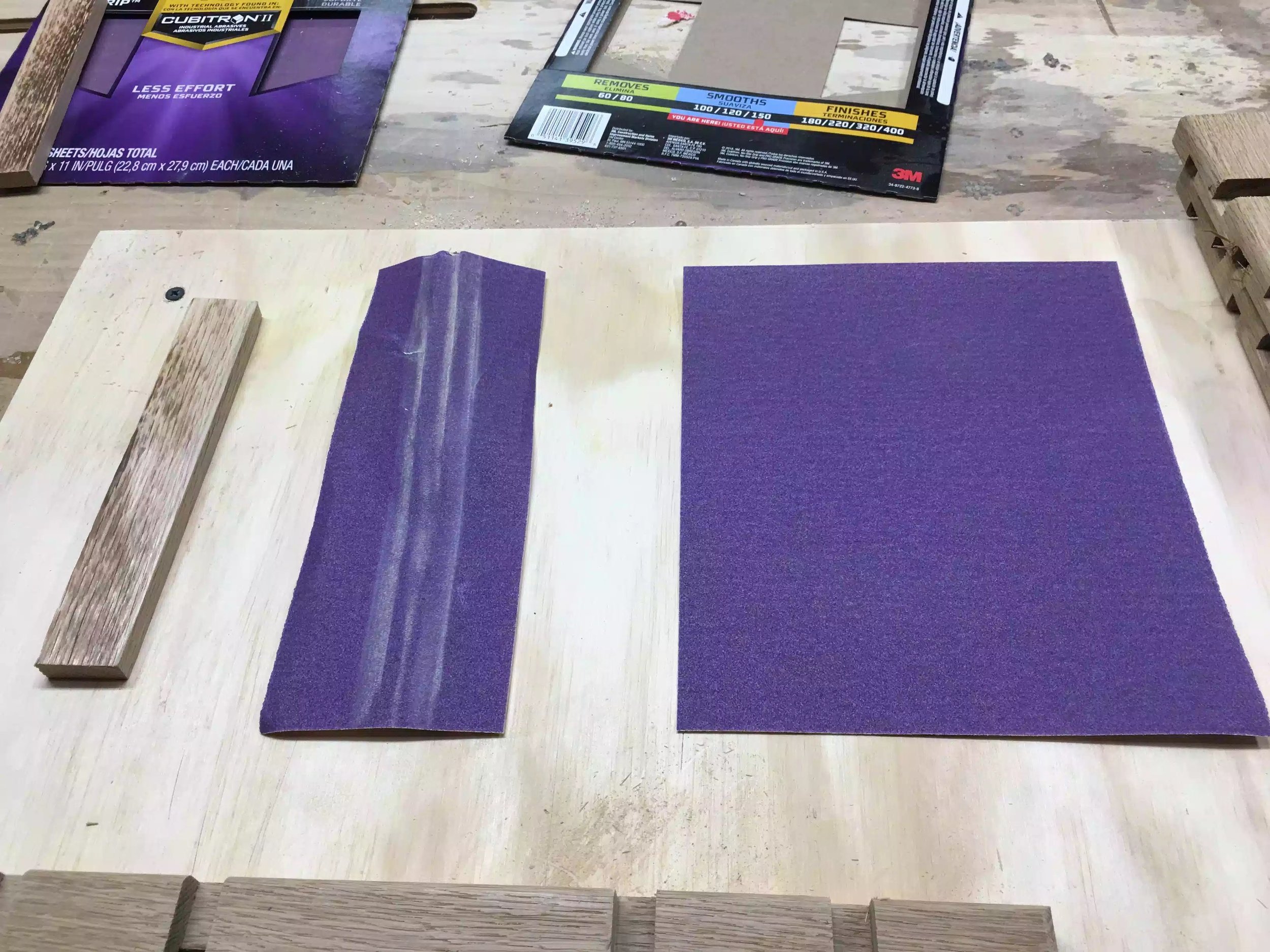 Here are my aids, 3/8” thick scrap piece of wood that I used to wrap the sandpaper onto and moves in and around all the grooves with ease.
