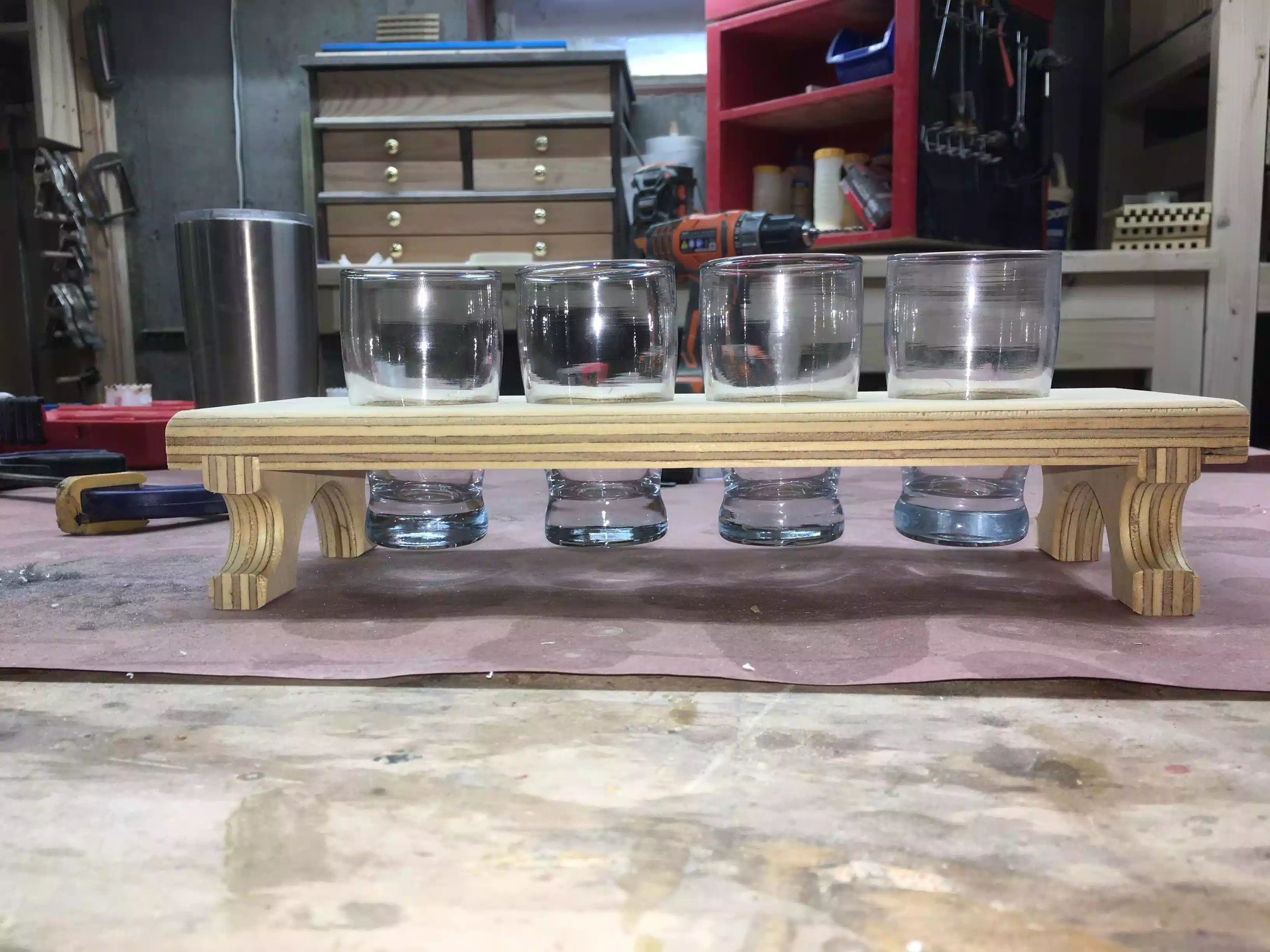Frontal picture showing the glasses in there homes, there is about 1” clearance from the glasses to the table-top. Love the dado joint.