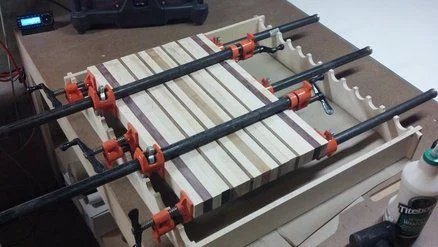 As you can see its a front and back rail with stretchers on either side, he notched out half circles to accommodate the pipe clamps, The stretchers are help together using a half-lap joint and when not in use can be just pulled up and the jig can be stored away.I think I will make mine the same but I will add different sized stretcher depending the size of clamps I will be using, they usually range from 12” - 36”. Click here for the website I found this on.