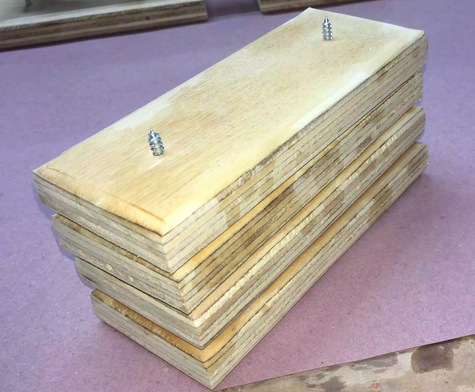Here is a few stacked, makes storage easy. As you can see on one I have screws protruding through the top, this is what your work piece sits on while applying the finish.