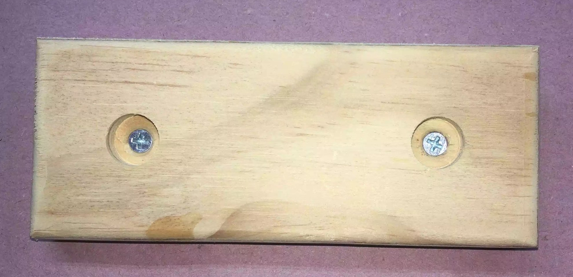 Here is the top side of the stand, I used a forstner bit to drill a recess into the top that way the screw protrudes and allows each stand to sit onto each other.