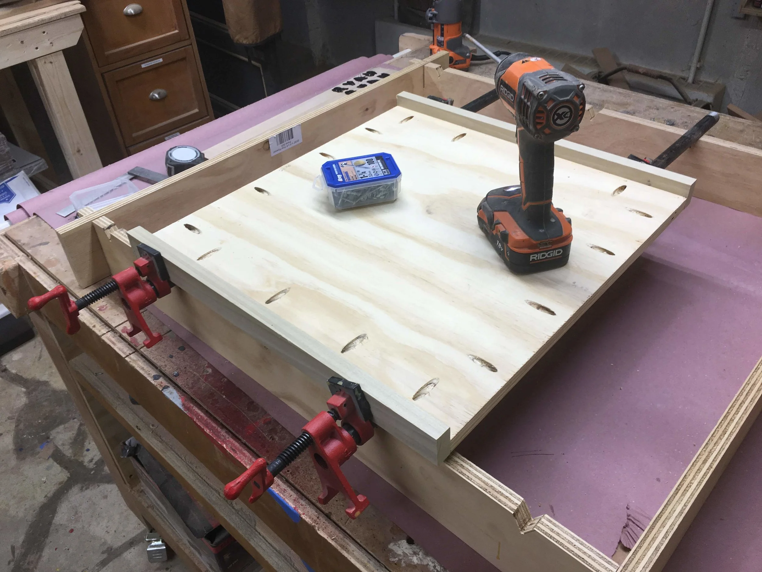 Here is another image of pipe clamp set-up I used the clamps because when using pocket holes they have the tendency to move the work-piece as you are screwing the pocket hole screws home, this set-up alleviates that.