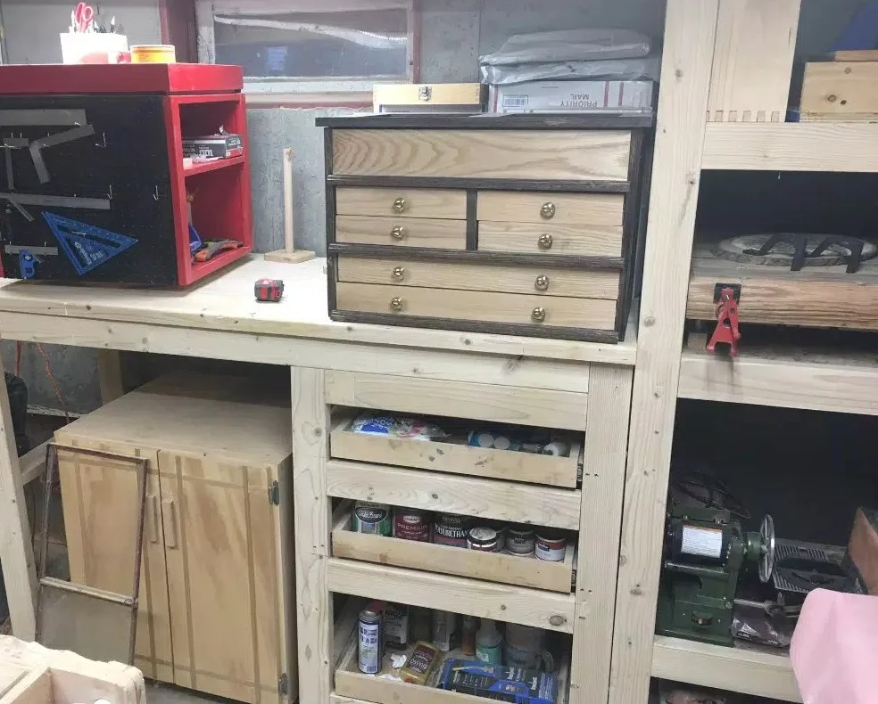 The bench that I had made and attached to the shelving unit was designed way too high so 9 could store my router table under, and the bench height was just too high to do any type of work on.