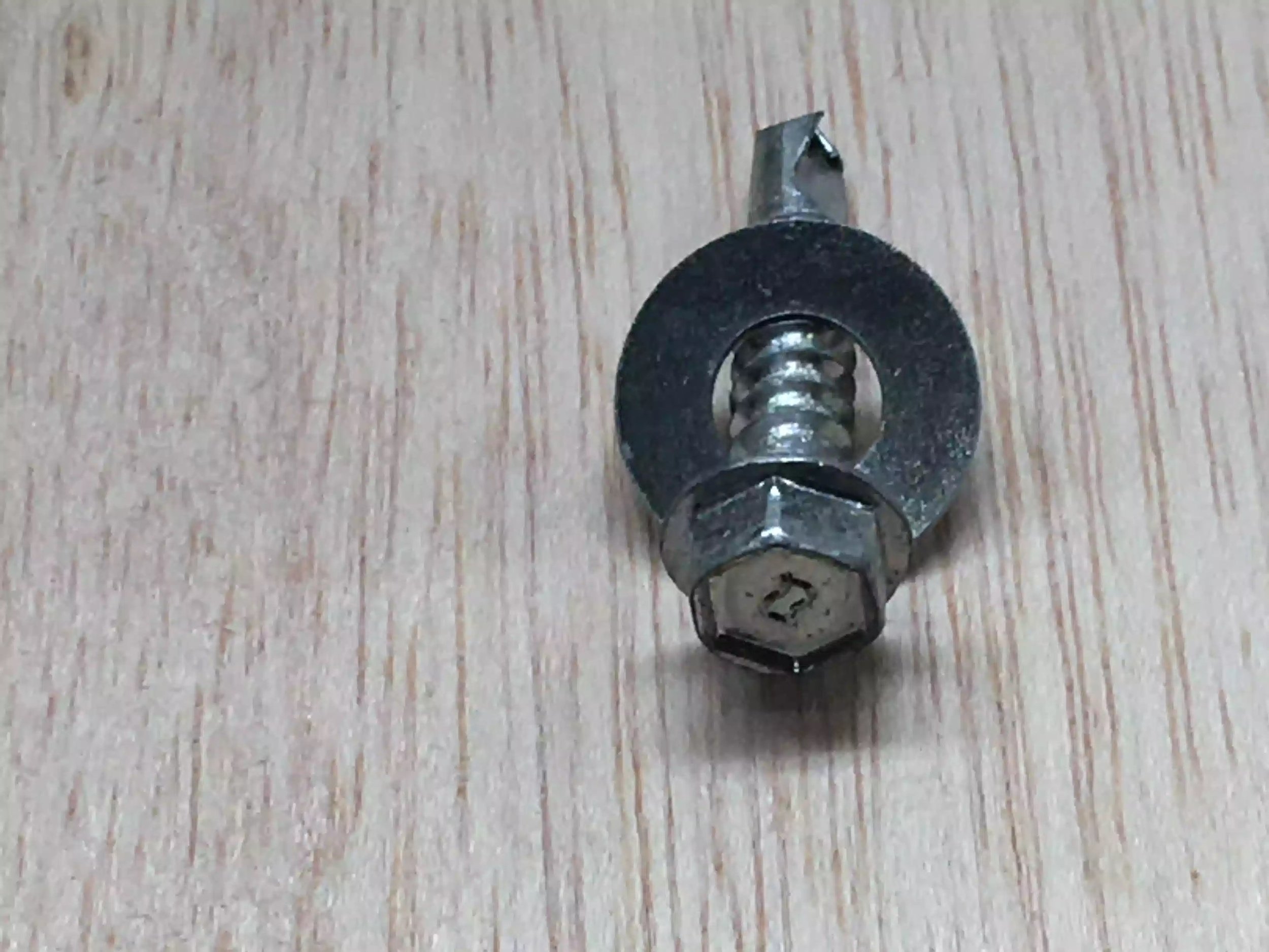 Here is the self tapping screw, I just add a washer and using my driver I screw them home.