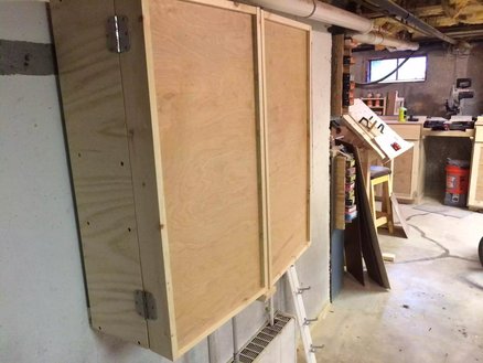 When not in use the doors close up and provide plenty of protection from a dust workshop, I used simple butt hinges.