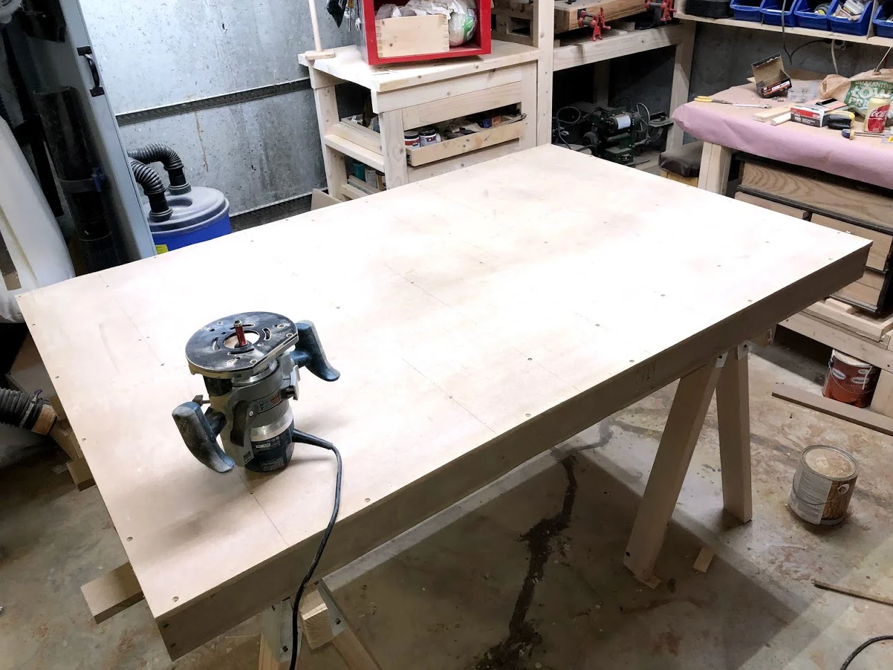 After the skin is installed I also added a few screws and then using my router I flush trimmed the top making sure that all edges lines up.. I will be attaching my solid wood trim to the outside of the torsion box by the end of the project.