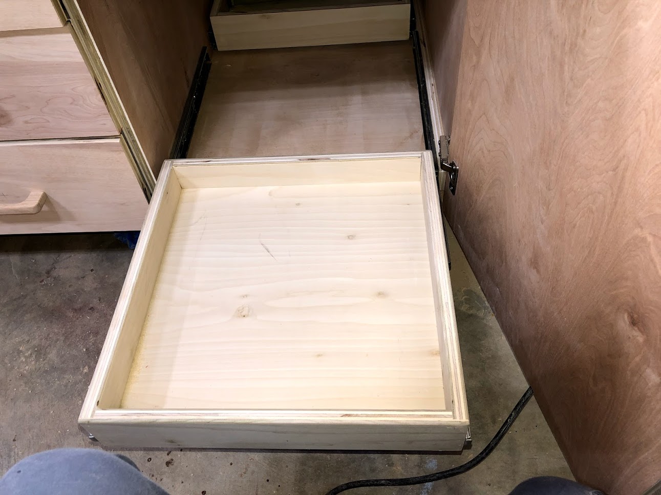 Since the tray operate on drawer slides it allows me easy access to the back of the tray