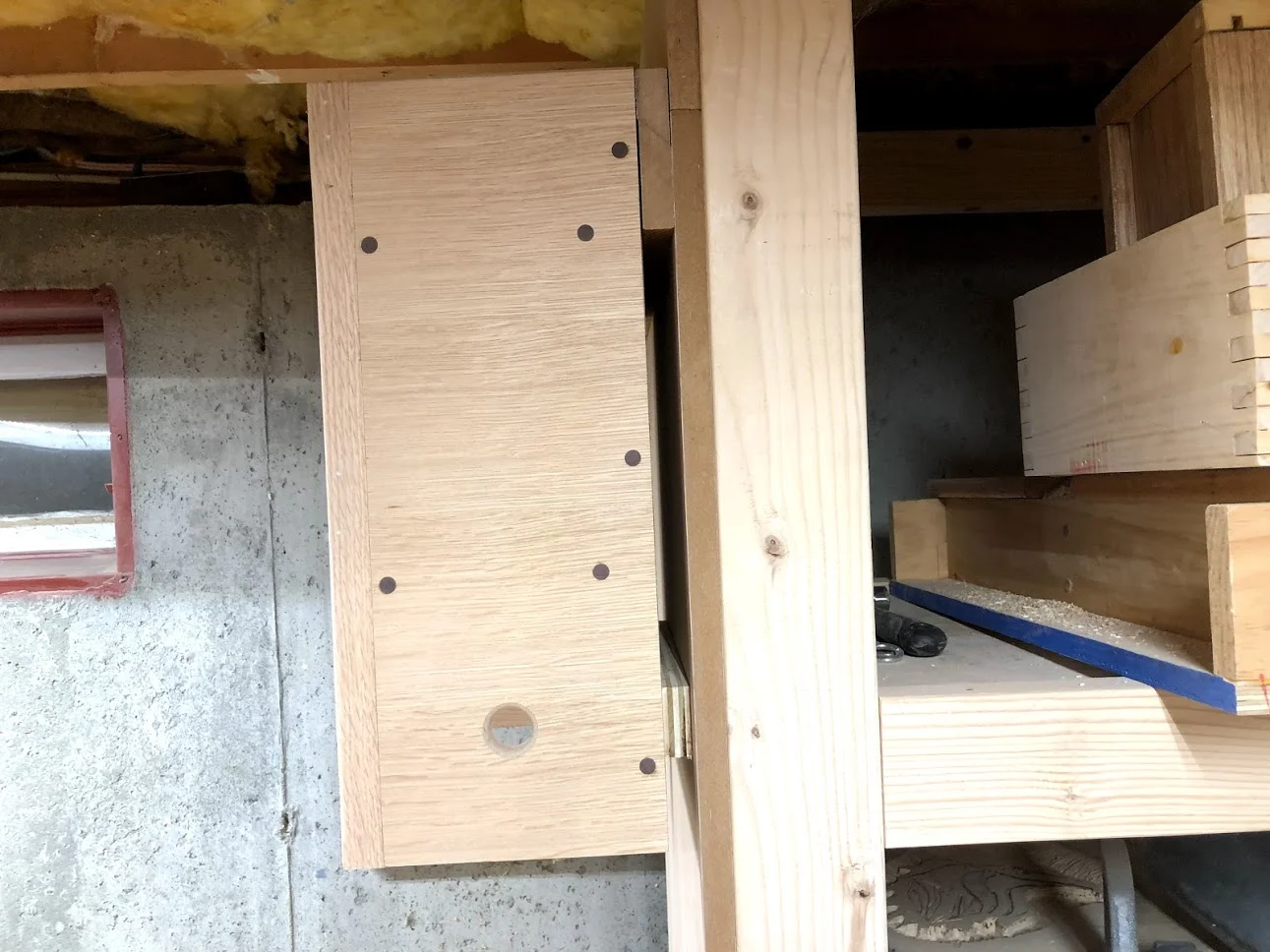 Here is he French cleat closed off, with the mating cleat on back of the unit and closes the cleat off so it doesn’t move. I also placed a 3/4” thick piece of plywood on the bottom of the unit to negate the need for the unit to lean forward and be plum on the wall.