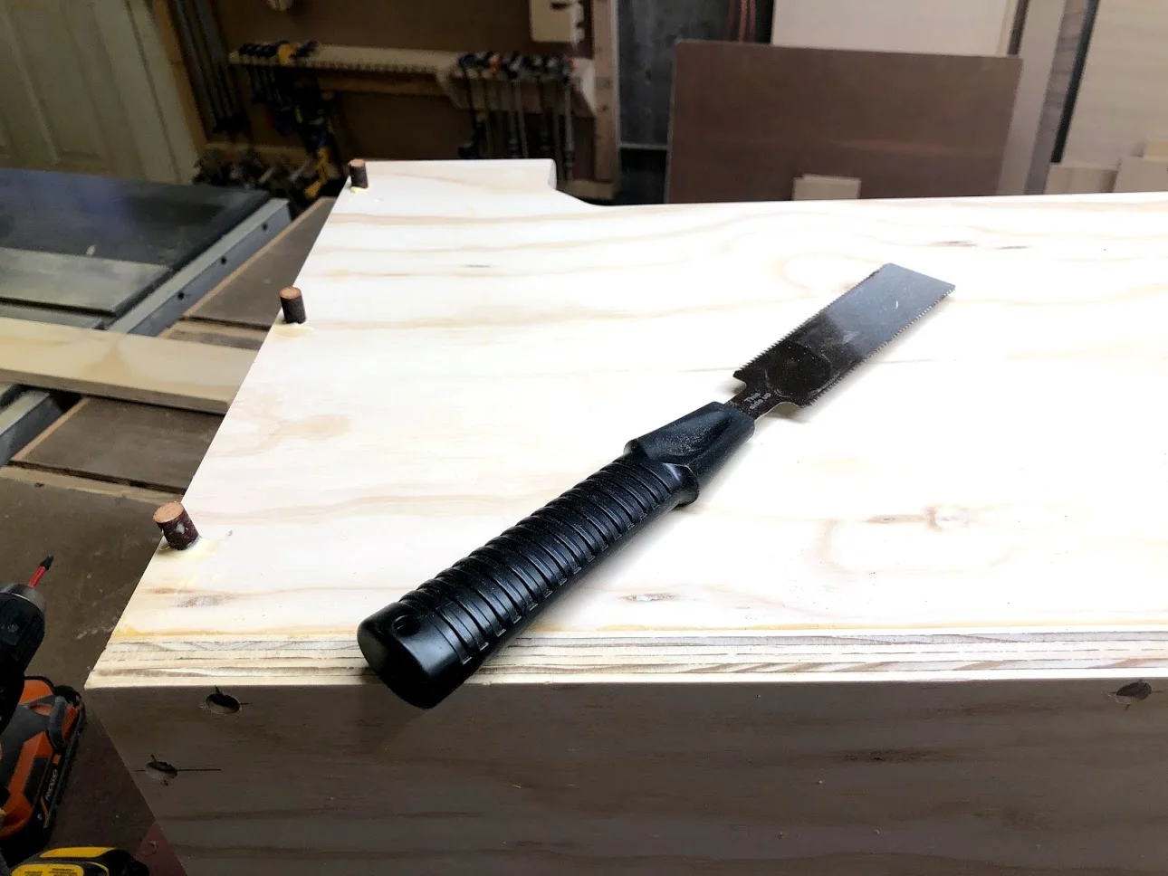 Plugs installed with the glue and my flush cutting saw waiting for the glue to be set.