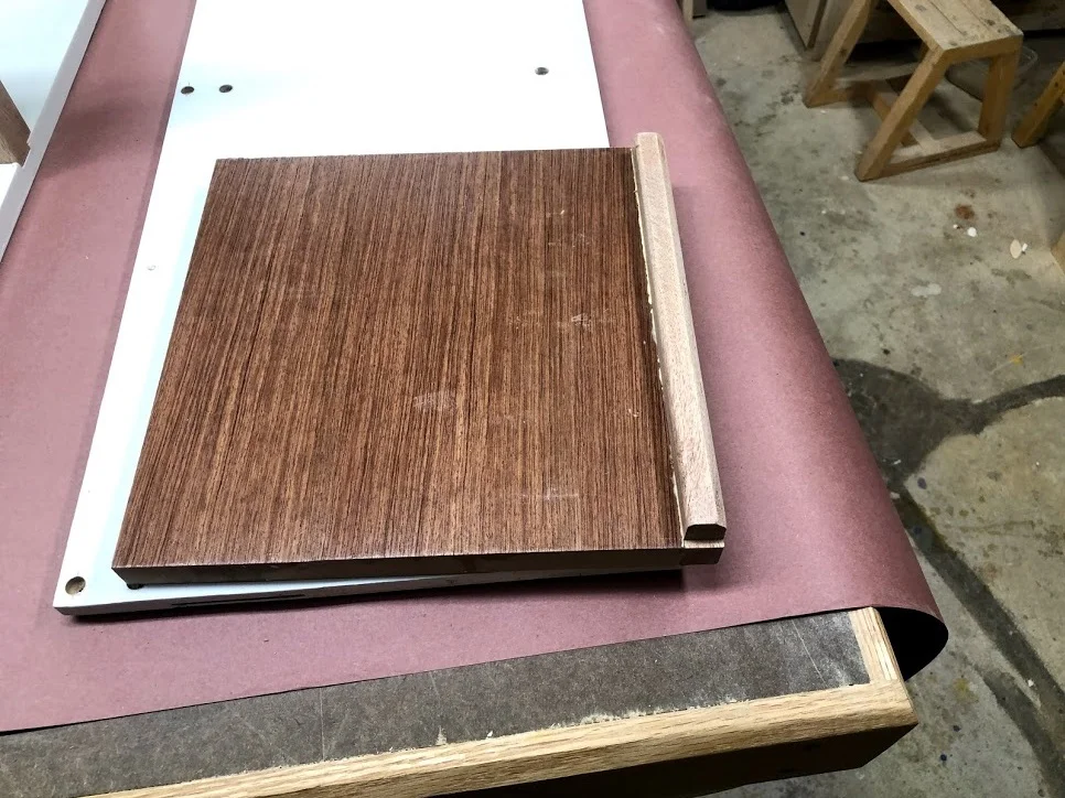 Here you can see the shelf with the front attached.