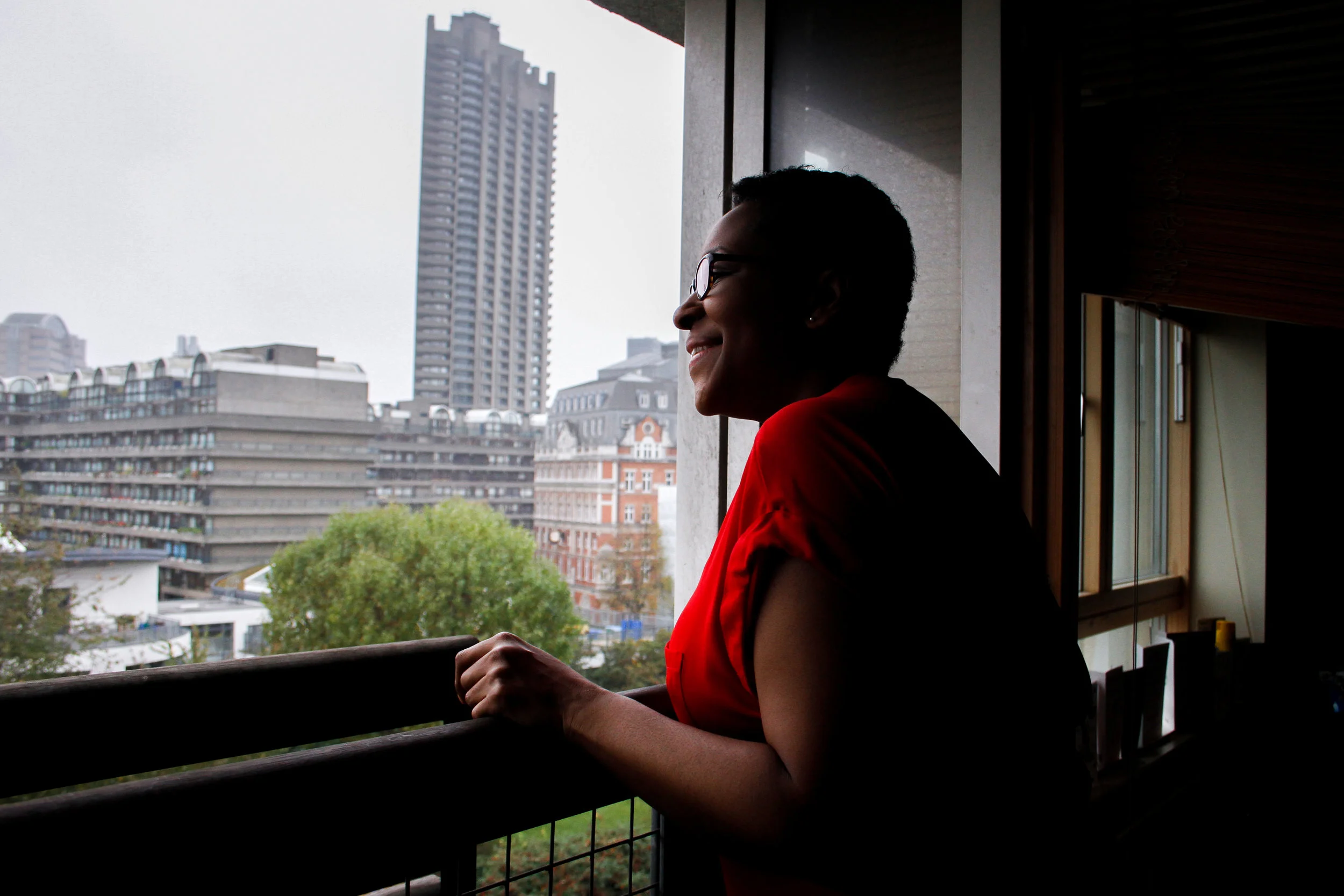 Fiona, on her balcony in St Mary’s Tower, the Barbican Towers in the background, Fortune Street, November 2017 -