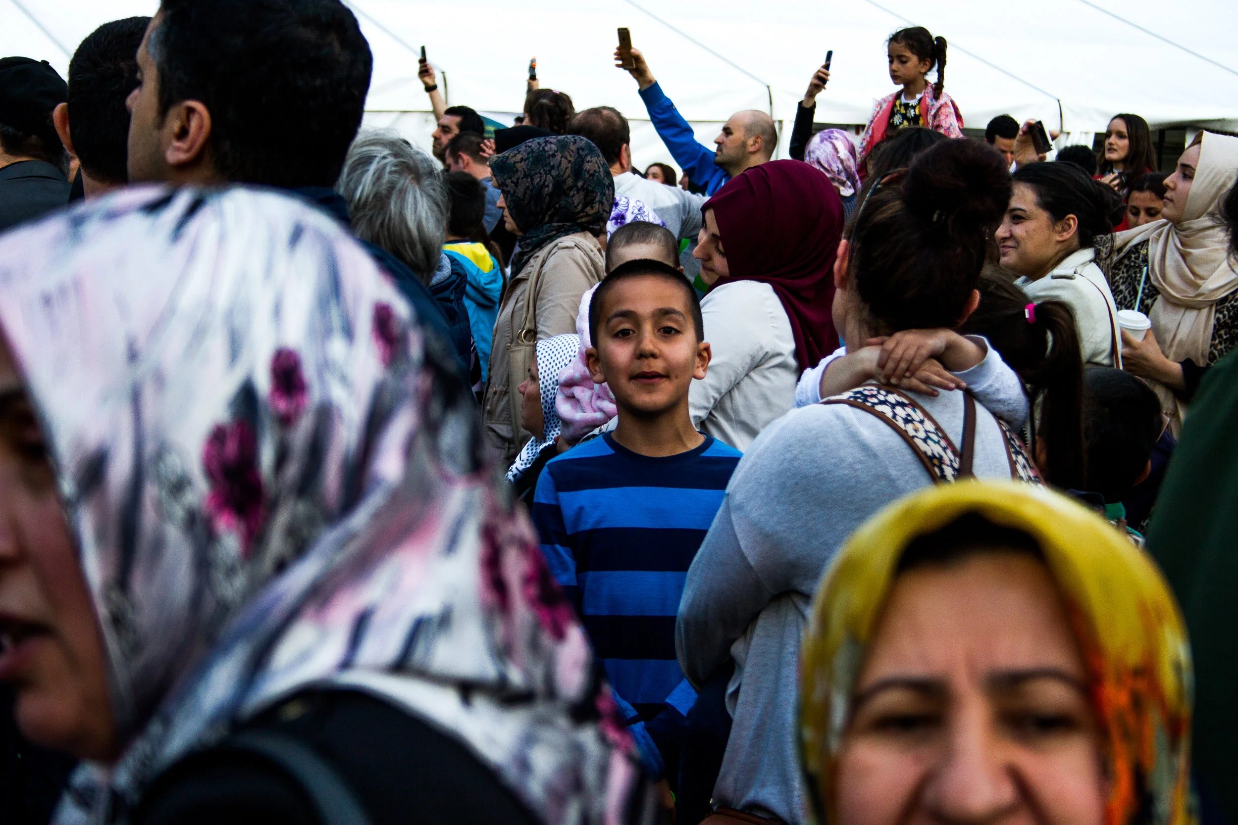 Turkish Boy amongst the crowd at the Anatolian Cultural Fete, Clissold Park, June 2018 -