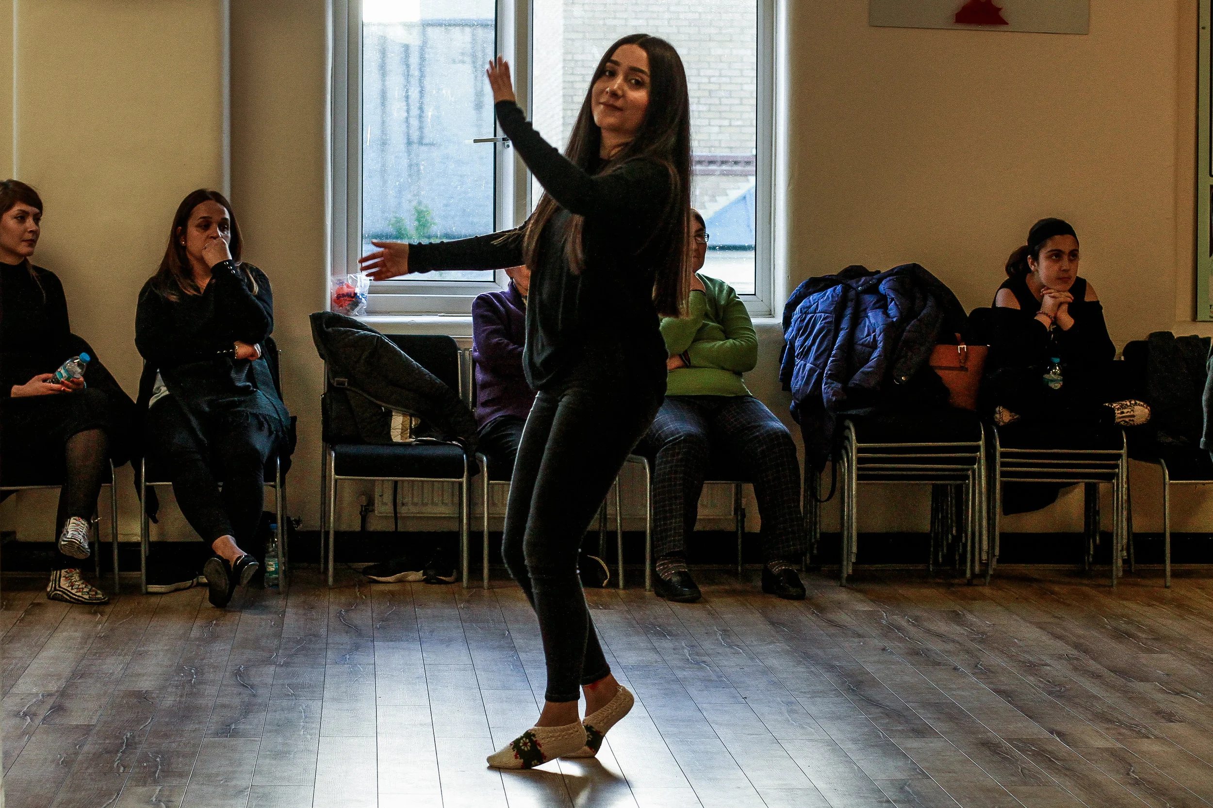 Girl performs the 'Semah', a traditional Alevi dance, Cem-Evi, Ridley Road, June 2018 -