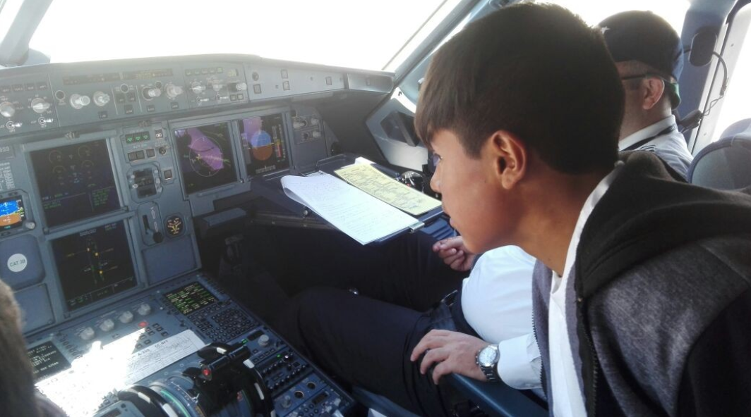 Eloy is invited into the cockpit.