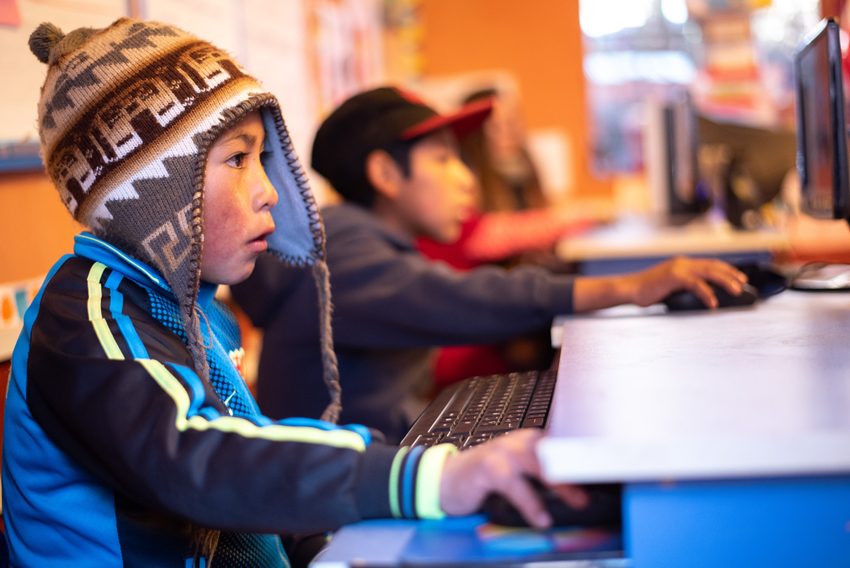 Pupils from Tamborpuqio's primary school learn mathematics with educational games on their computers.