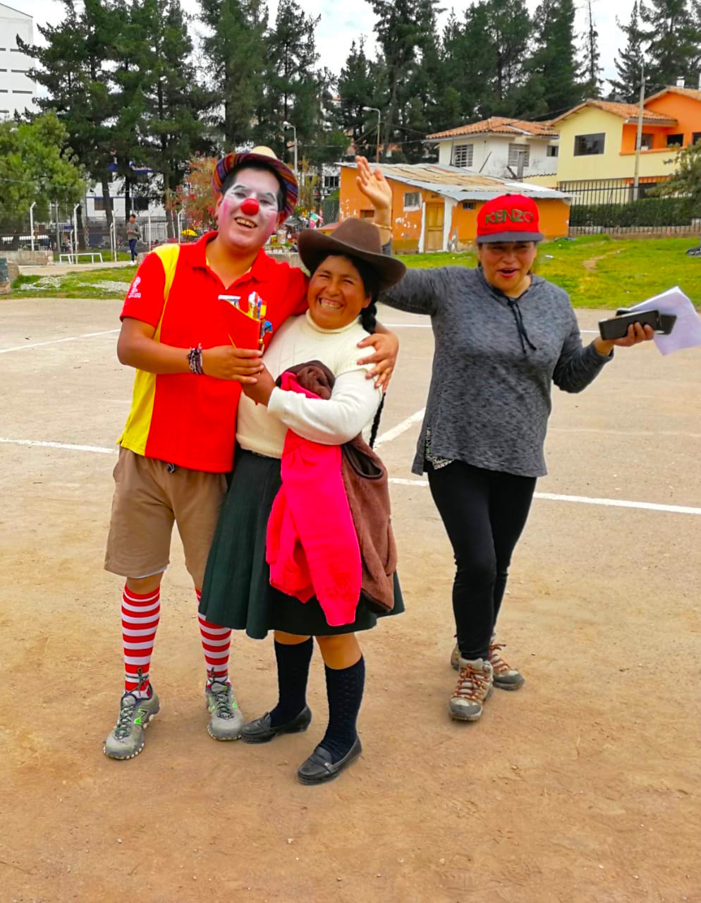 The Amantani team celebrate with one of the parents
