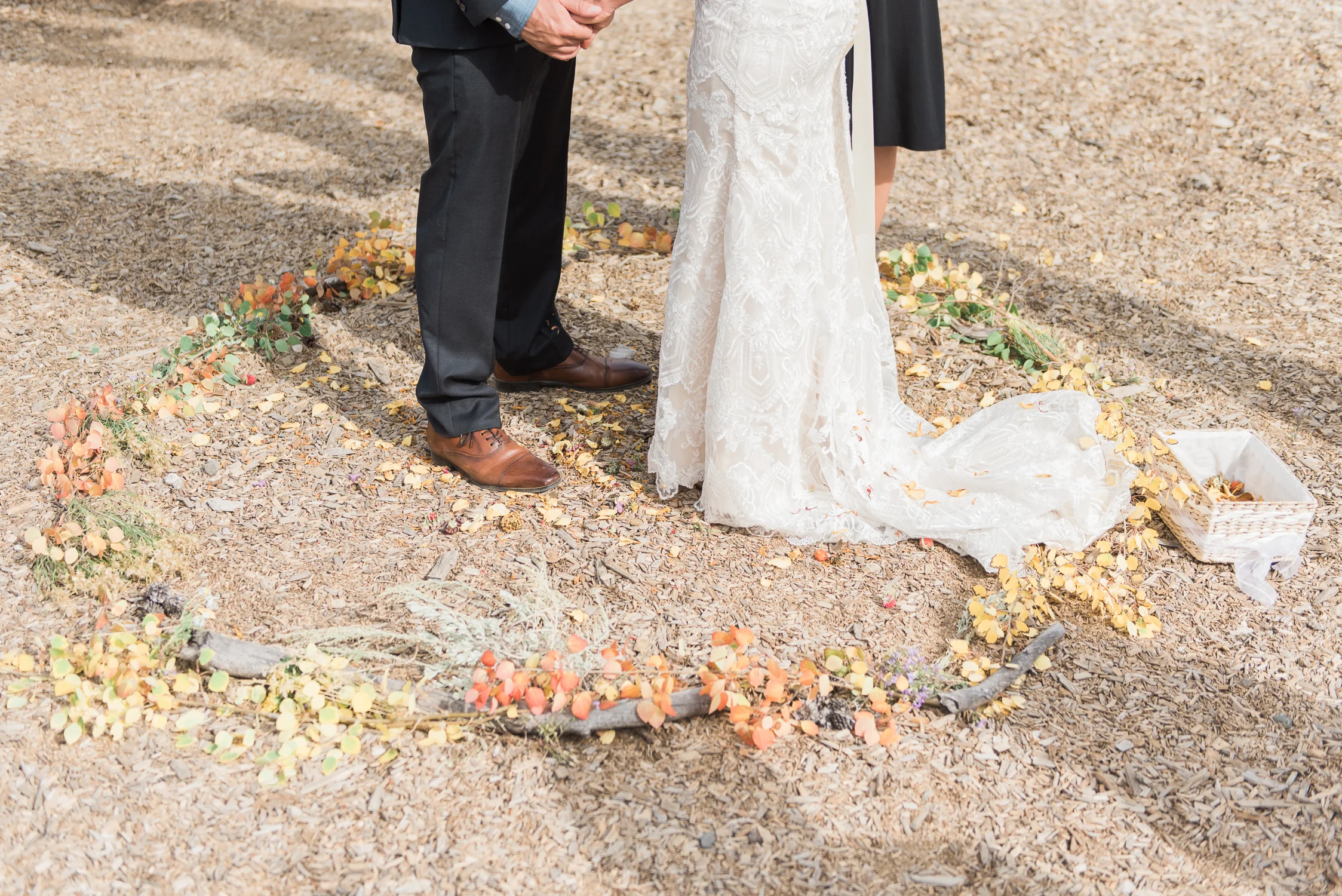 Intimate wedding alter circle of fall leaves for the ceremony site