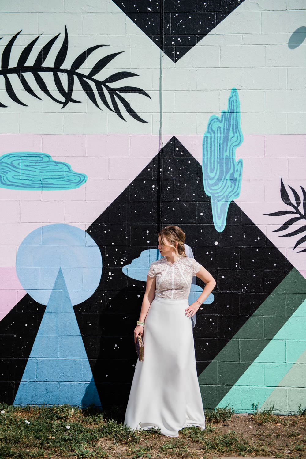 Bride in front of street art in Boulder, Colorado