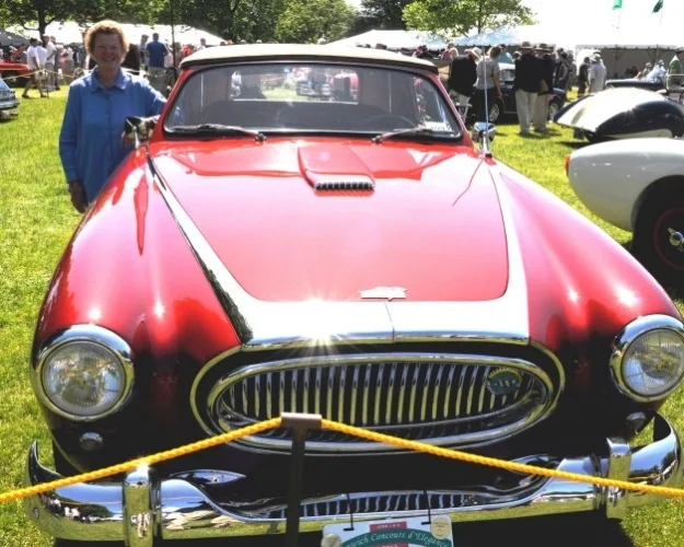 This exhibit is indeed a special one. Lucie C. McKinney stands with her superb Vignale bodied 1953 Cunningham C3 cabriolet created by her father, Briggs Swift Cunningham.