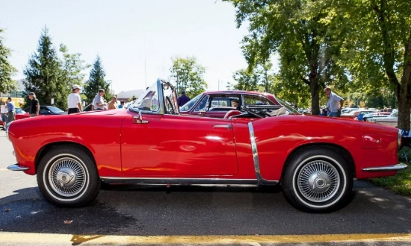 Lance Leviathan's Fiat 1200 convertible soaks up the fall sun nearby.