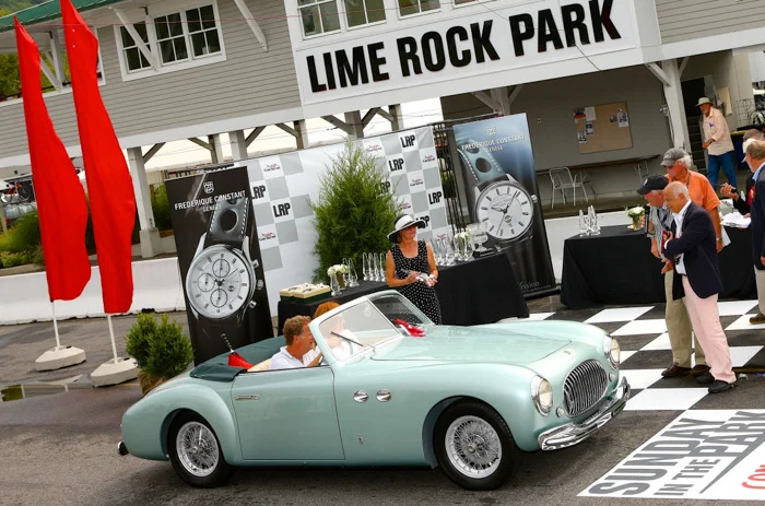 Andy Benenson and Elizabeth Jensen drive up for presentation of the award our honored collector Larry Auriana bestowed for the car he would most like to drive home
