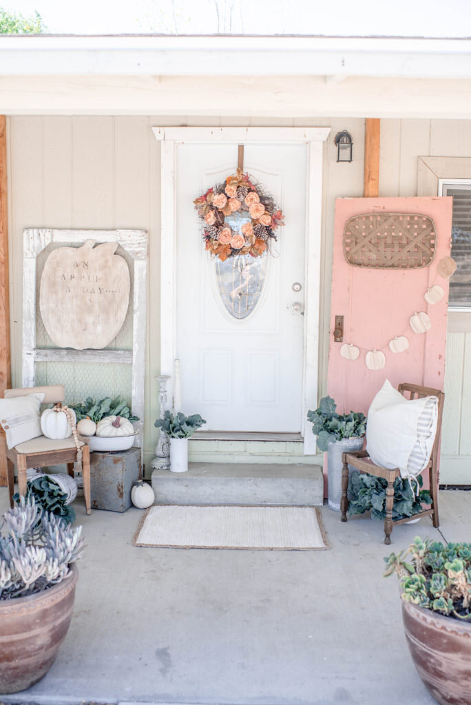 here is fall porch inspiration with a beautiful pink door from Corey at Hudson Farmhouse https://www.hudsonfarmhouse.com/pink-fall-front-porch-decor/