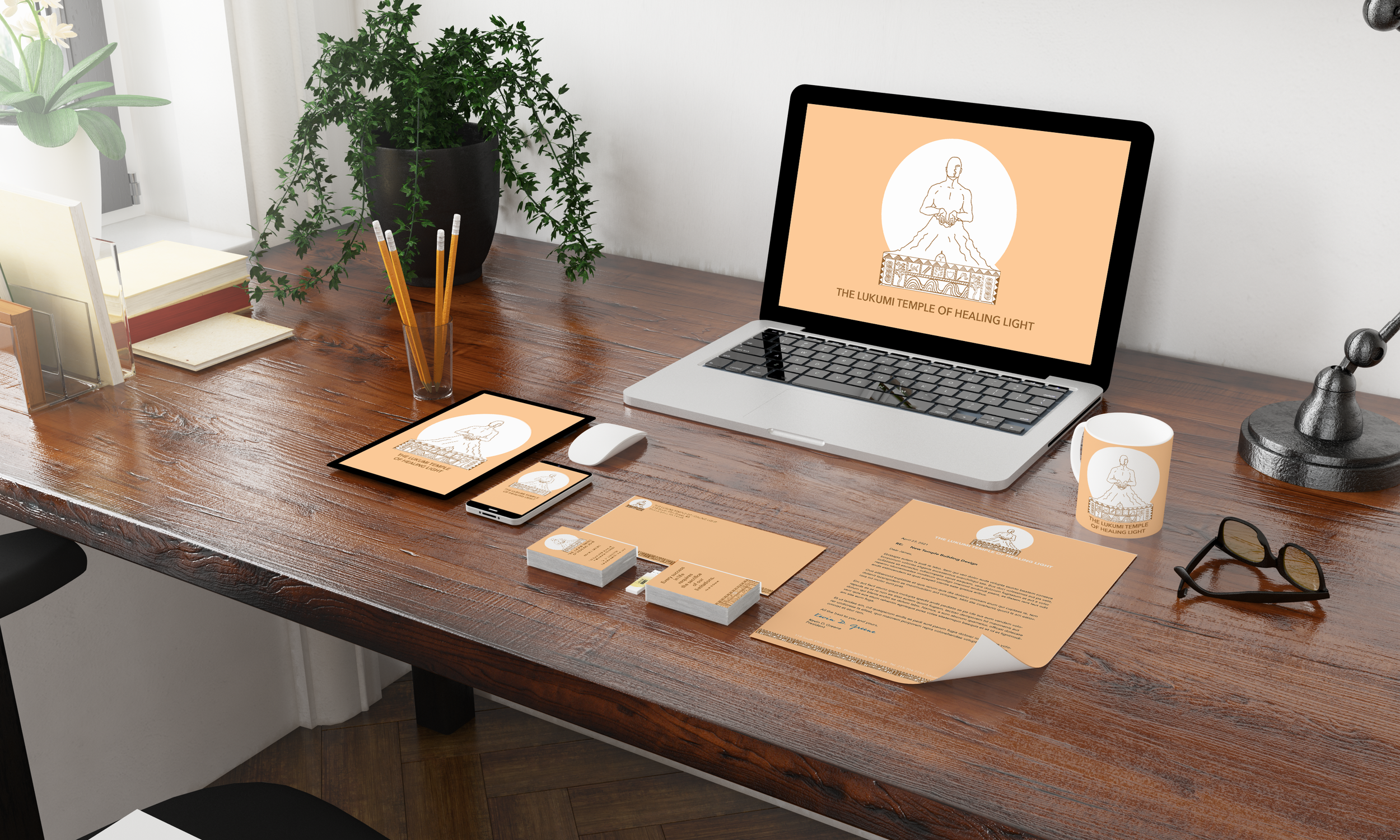 A cluttered office desk with various informational materials and branded items for 'The Lukumi Temple of Healing Light,' including a laptop, phone, business cards, pamphlets, a notebook, a mug, a pair of sunglasses, and a black sculpture, with a large plant in the background.