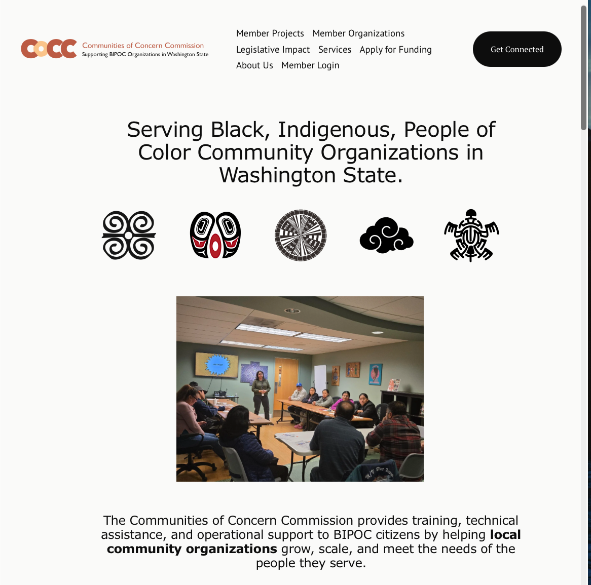 Screenshot of a website for the Communities of Concern Commission supporting BIPOC organizations in Washington state. The page features a logo, navigation menu, a header indicating focus on Black, Indigenous, and People of Color community organizations, icons representing different cultural symbols, and a photograph of a group meeting in a conference room with a woman presenting to seated attendees.