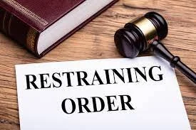 RESTRAINING ORDER AGAINST... WHO?