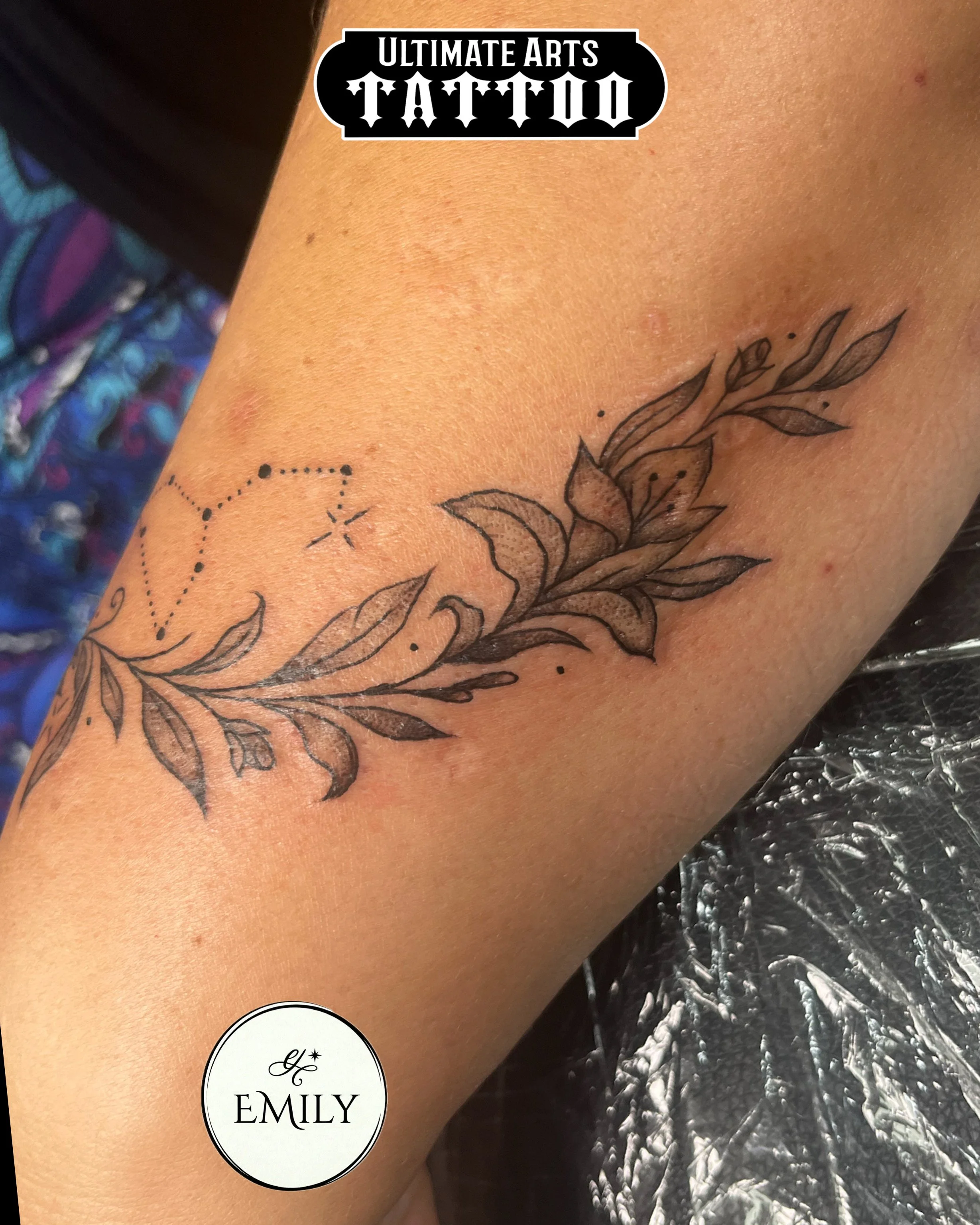 Leaves and constellation on an ankle tattoo by Emily