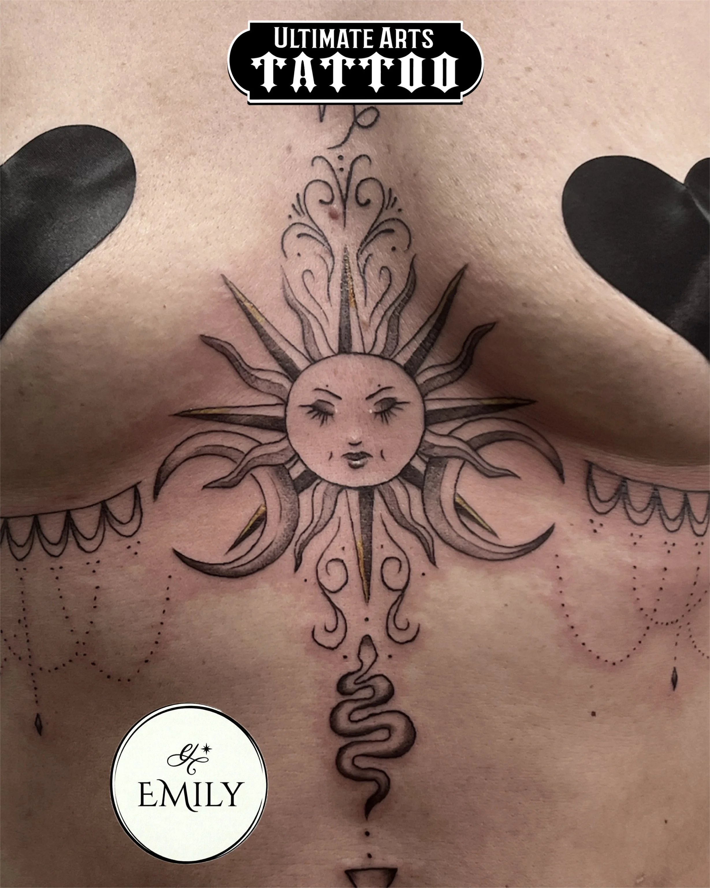 Sun and moons, ornamental lower sternum tattoo