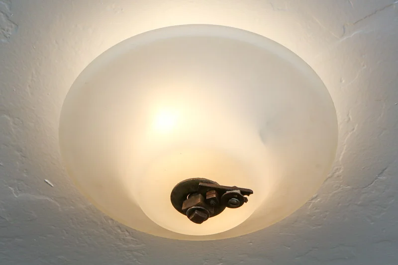 Light fixture with salvaged bolts