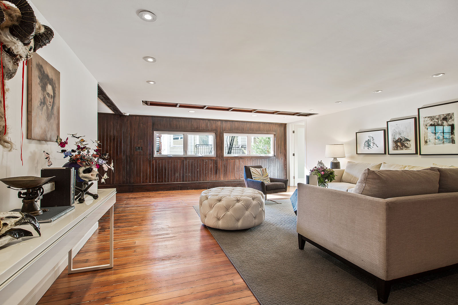 Second floor lounge with original ramp connecting third and first floor visible in the ceiling 
