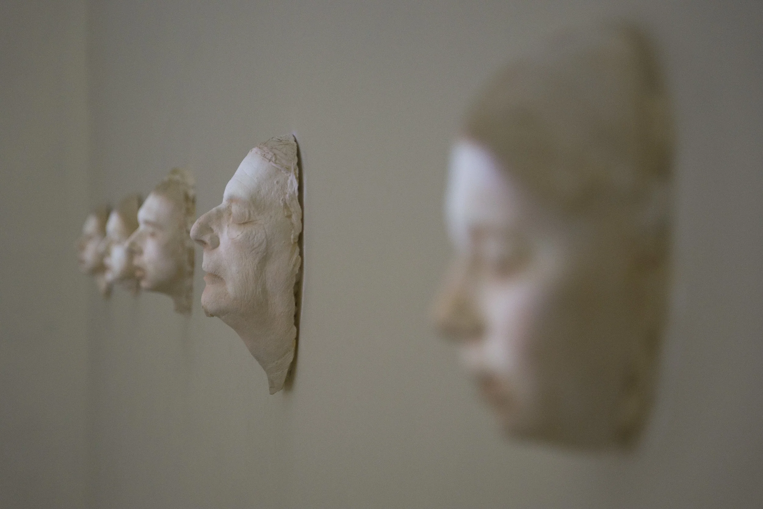 Family, 2015. light projection on photographic casted plaster