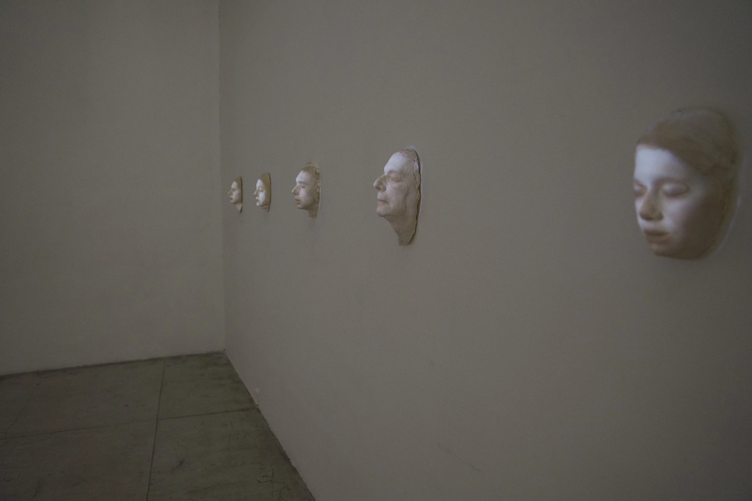 Family, 2015. light projection on photographic casted plaster