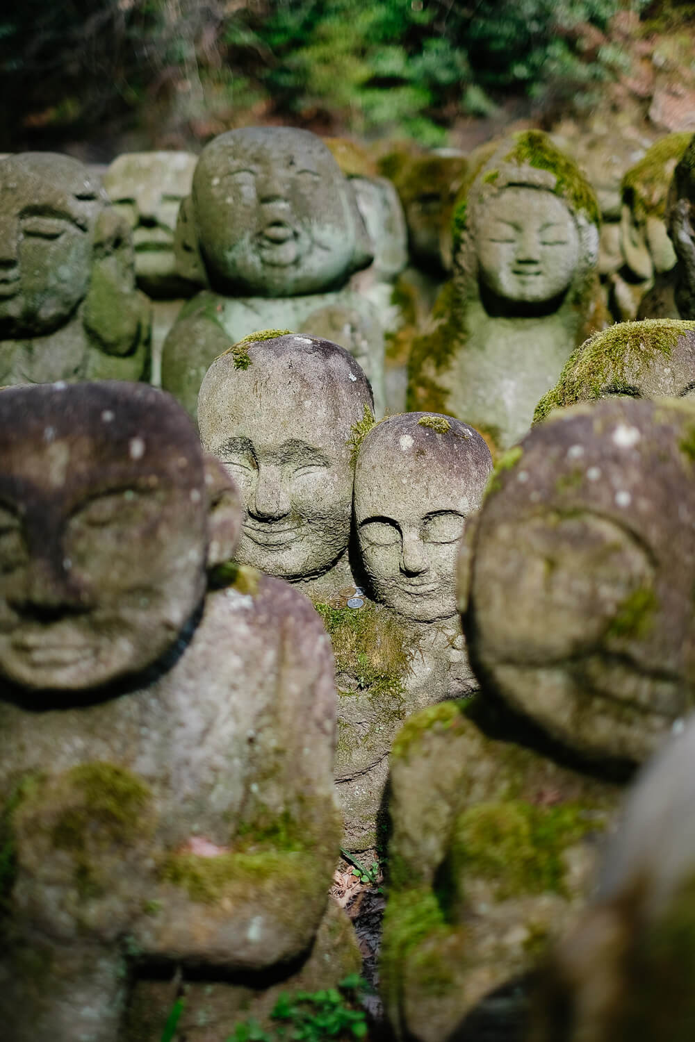 Two loving buddhas at Otagi Nenbutsu-Ji, Kyoto. Travel photography and guide by © Natasha Lequepeys for "And Then I Met Yoko". #japan #japanitinerary #travelblog #fujifilm #asia 