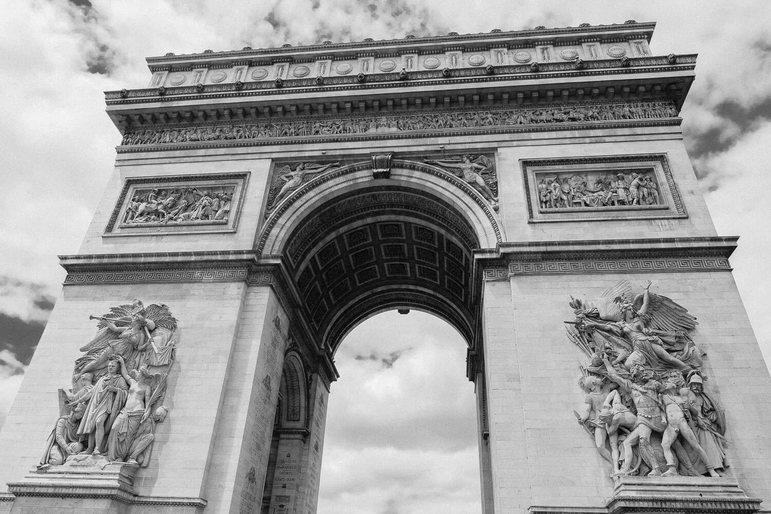The Arc de Triomphe in Paris. Travel photography and guide by © Natasha Lequepeys for "And Then I Met Yoko". #paris #paristravel #photoblog #travelguide #france #parisitinerary #parishighlights #parissights #travelblog #travelphotography #landscapephotography #travelitinerary #fujifilm #paristravelguide #architecturephotography #europe #travelblogger #wanderlust #explore #travel