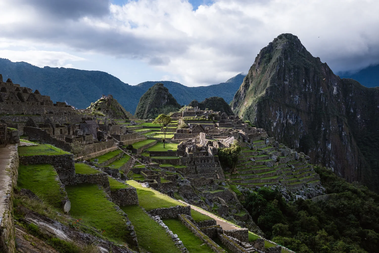 A photographic travel guide visiting Machu Picchu. Travel photography and guide by © Natasha Lequepeys for "And Then I Met Yoko". #machupicchu #shortincatrail #huaynapicchuhike #incatrail #aguascalientes #sacredvalley #peru #travelguide #photoblog #travelblog #travelphotography #landscapephotography #travelitinerary #machupicchuitinerary #fujifilm #southamerica #huaynapicchu #dayhike #ancientruins #visitperu
